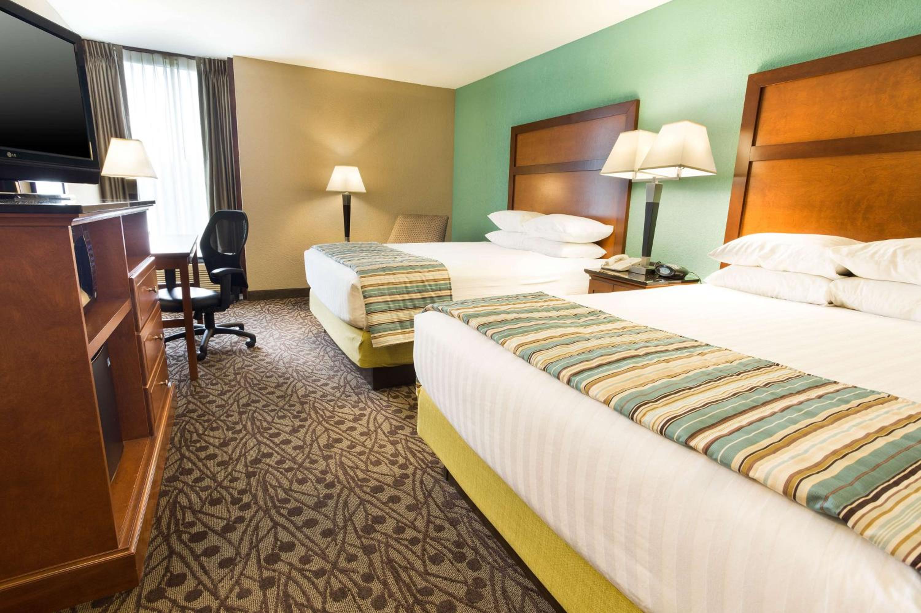Deluxe Queen Room with Two Queen Beds - Photo 1