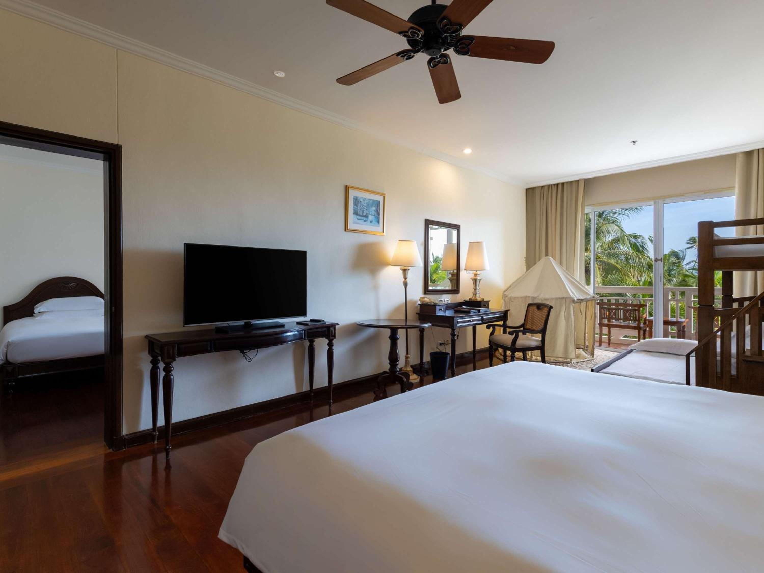 Two-Bedroom Family Room with One King Bed, Triple Bunk Bed, Two Single Beds and Private Balcony