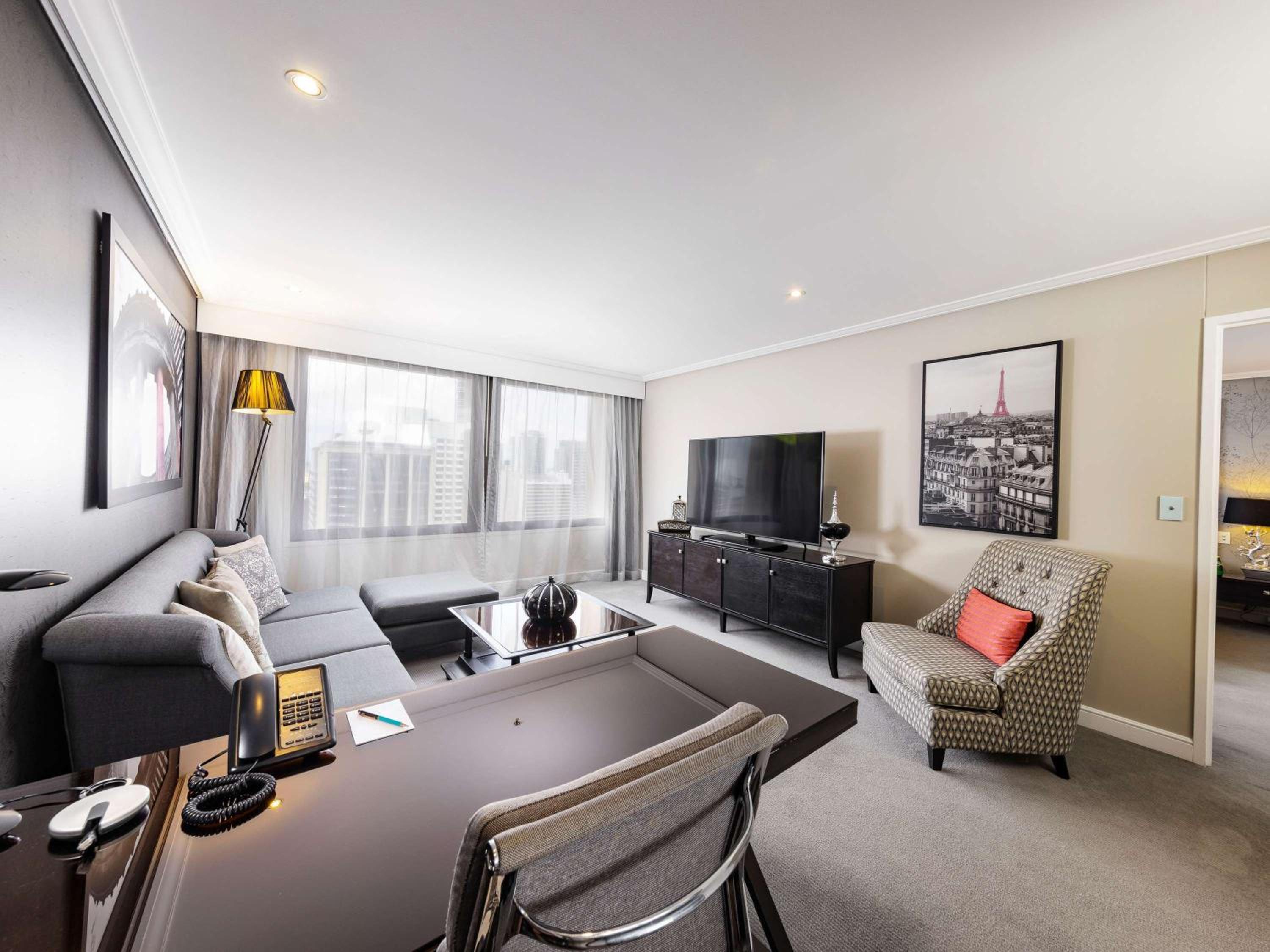 PREMIER SUITE King Bed, Separate Lounge, City View, Premium Bath - Photo 7