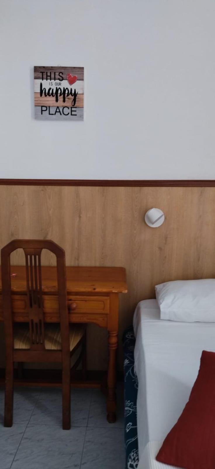 Habitación individual con baño compartido