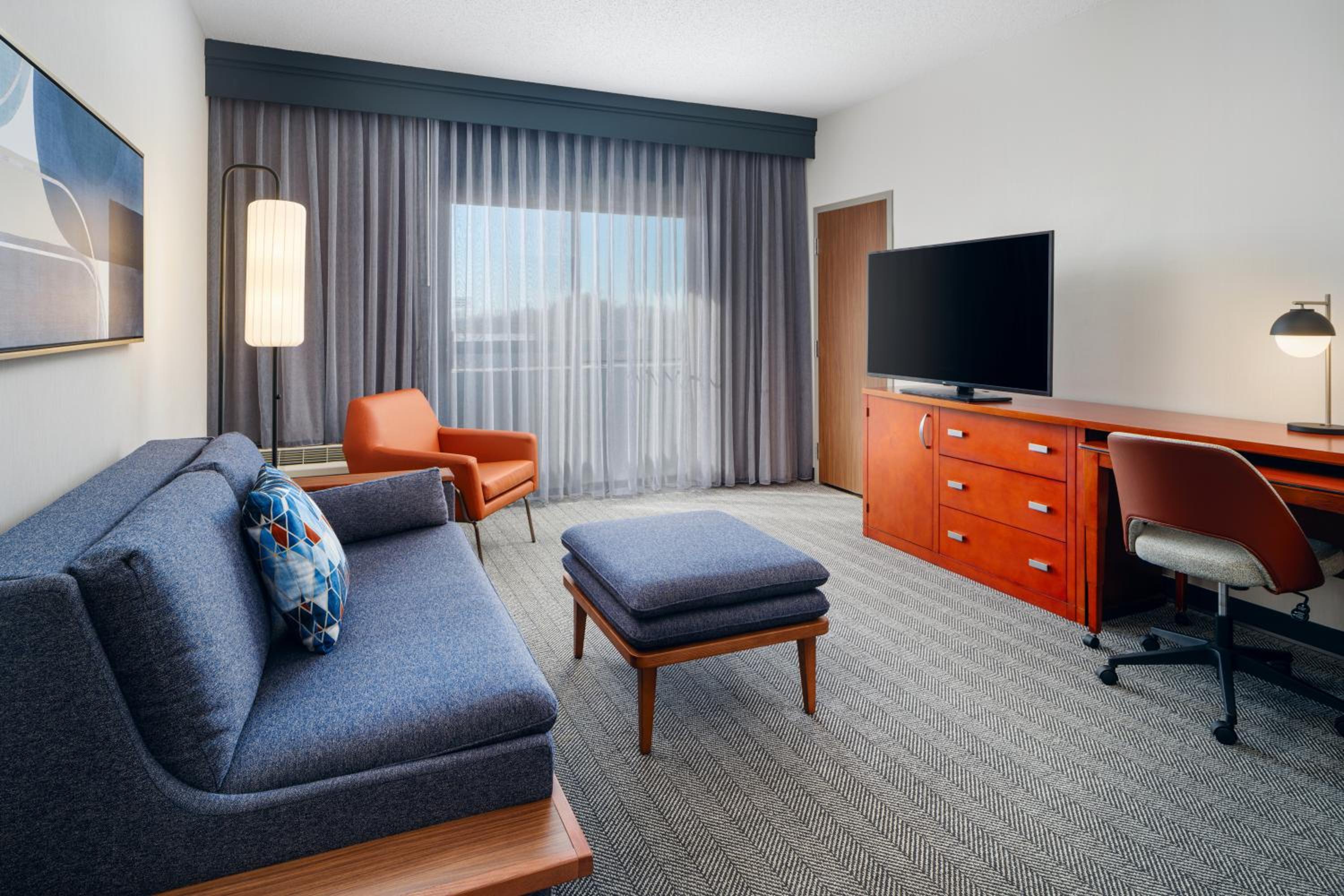 One Bedroom Suite with Two Double Beds and a Sofa Bed