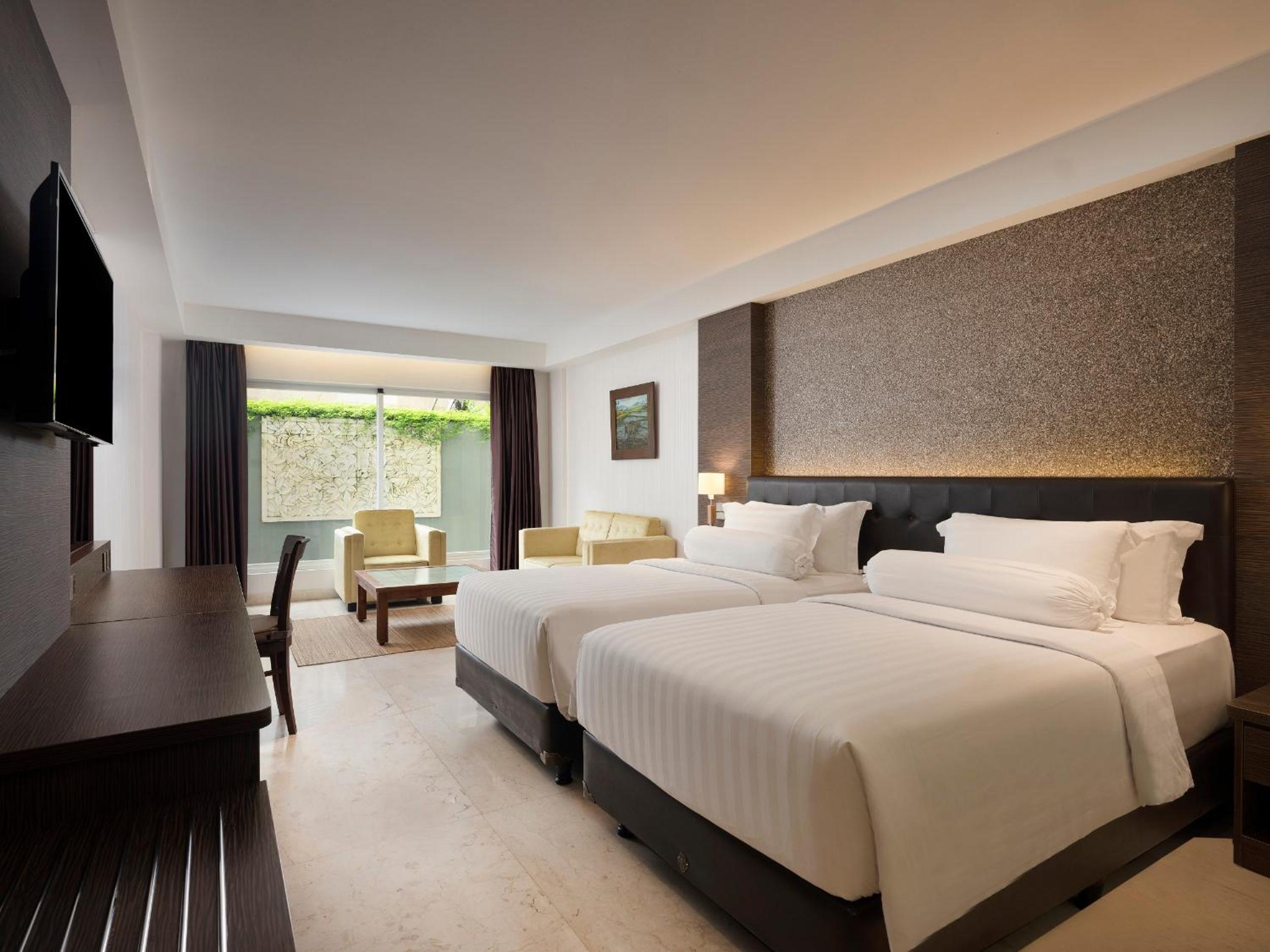 Deluxe Family King Room, with FREE daily shuttle to Ubud City, FREE Photo Session, FREE Art Gallery Visit, 24-hour access to Fitness Center, FREE Welcome Drink, and FREE Kids Activities.