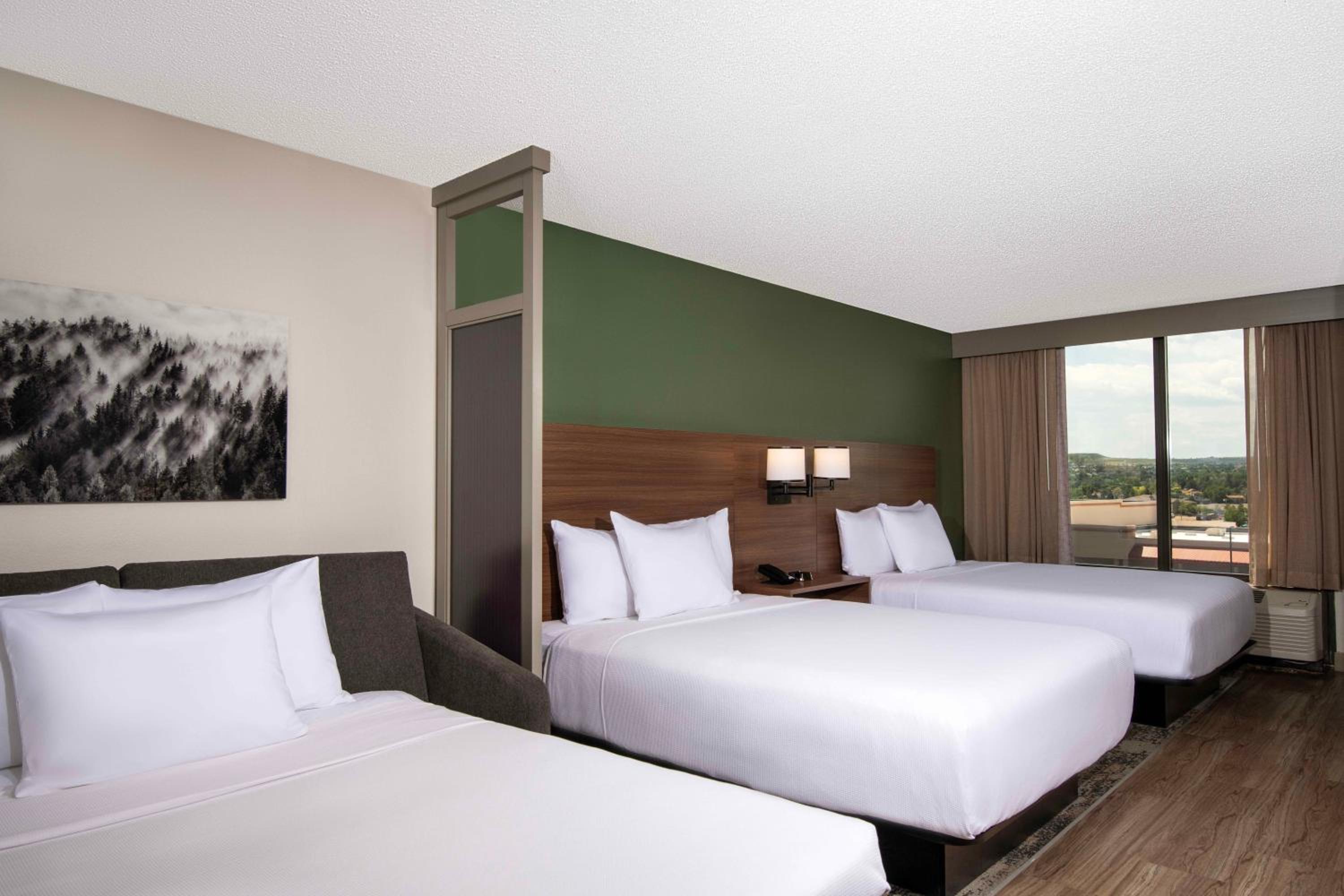 Queen Room with Two Queen Beds and Sofa Bed - Photo 2