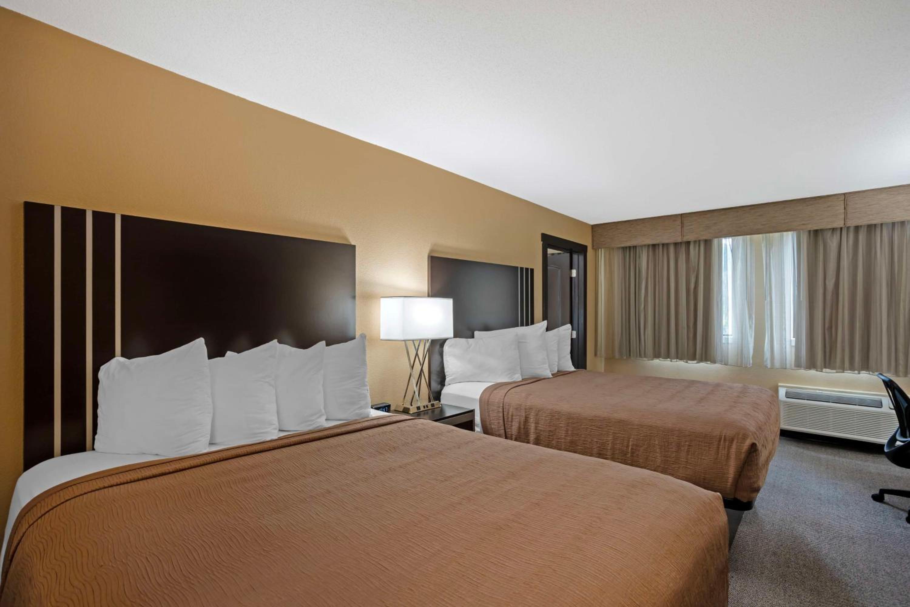 Queen Suite with Two Queen Beds and Sofa Bed - Photo 2