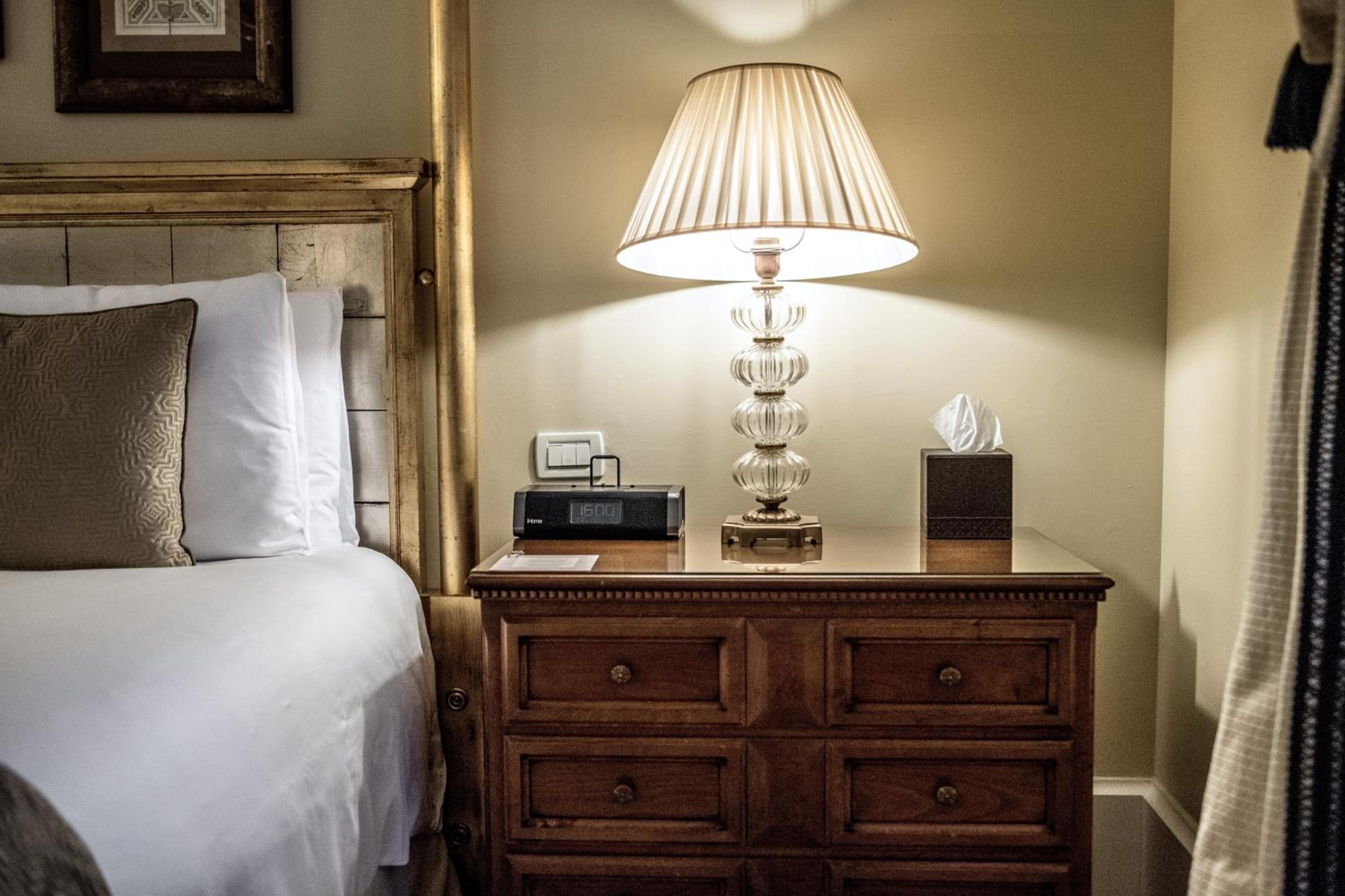 bedroom with a bed, nightstand, and night stand