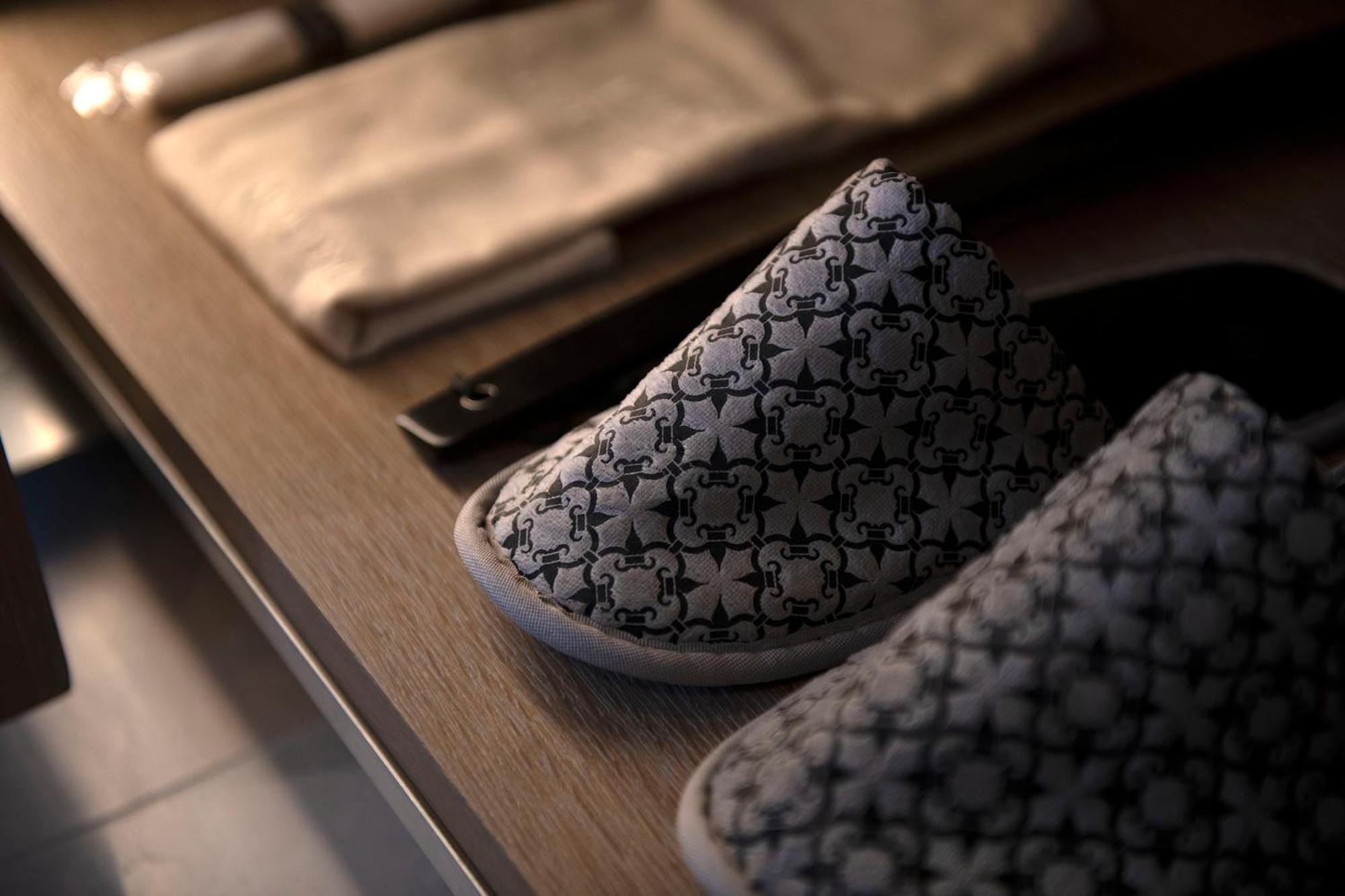 pair of men's slippers on a table