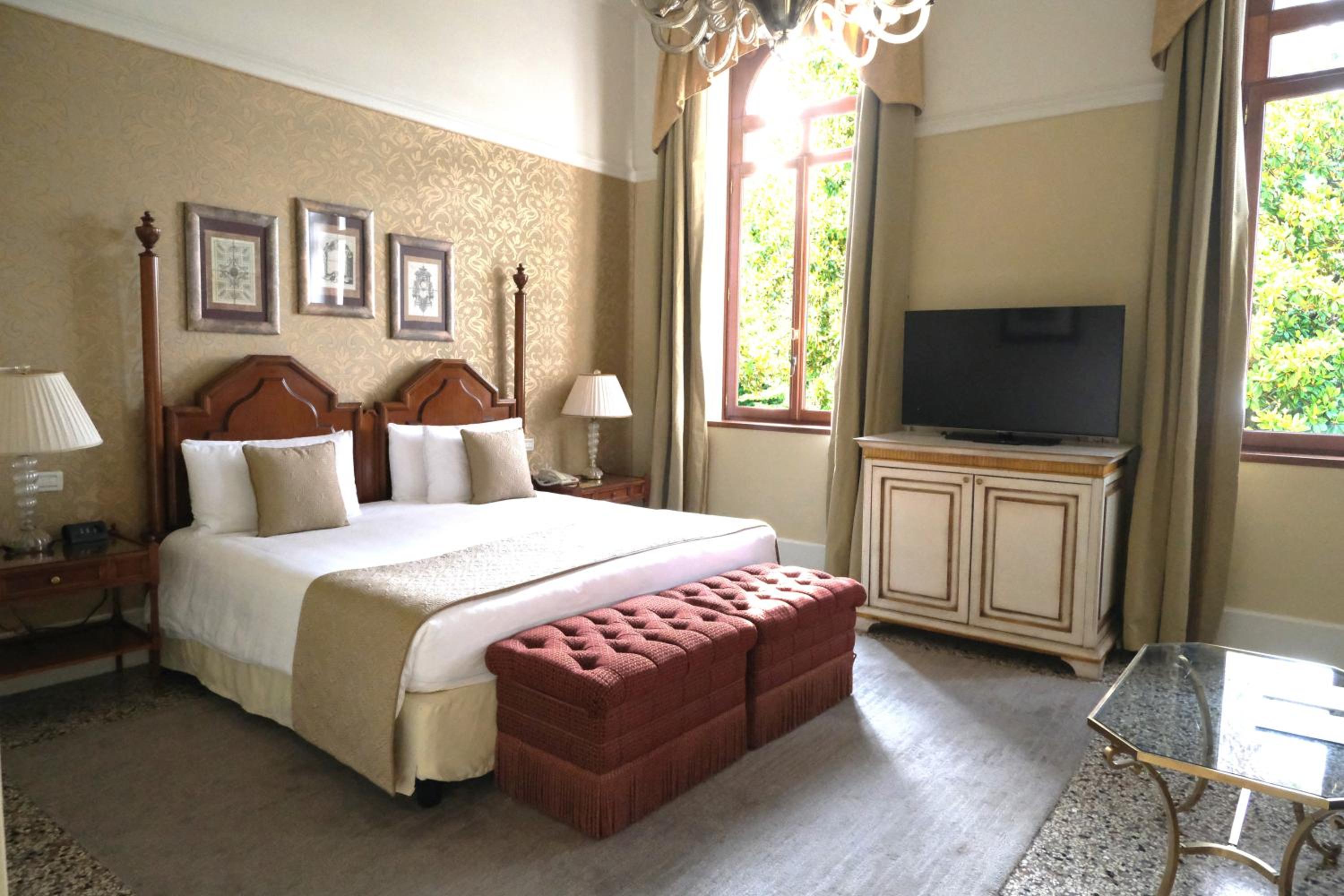 bedroom with a large bed and a flat screen tv