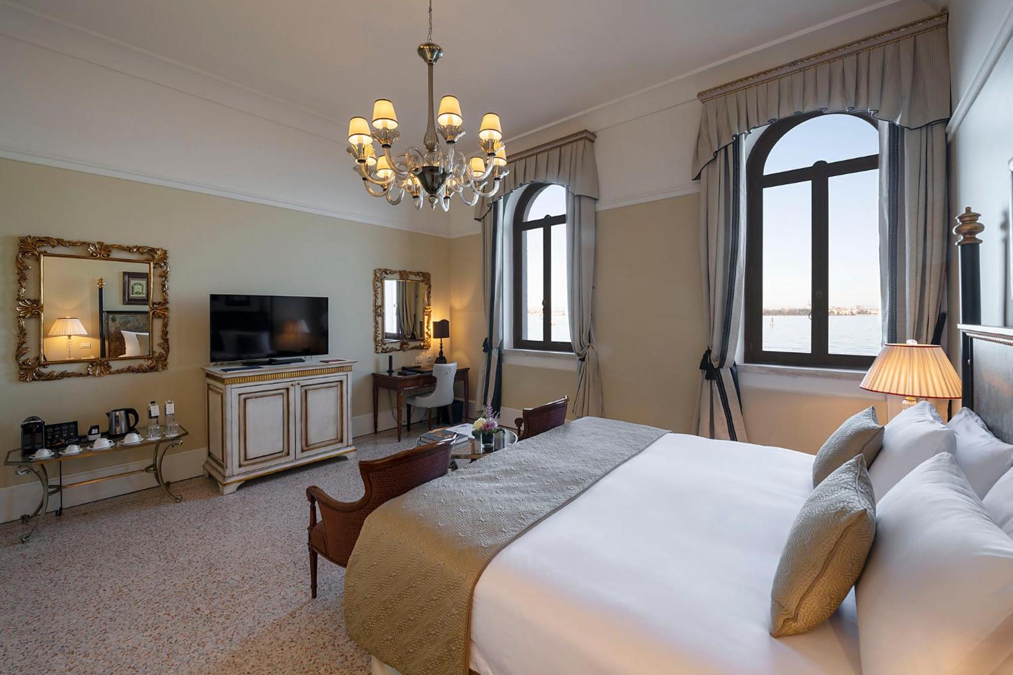 bedroom with a large bed and a chandelier