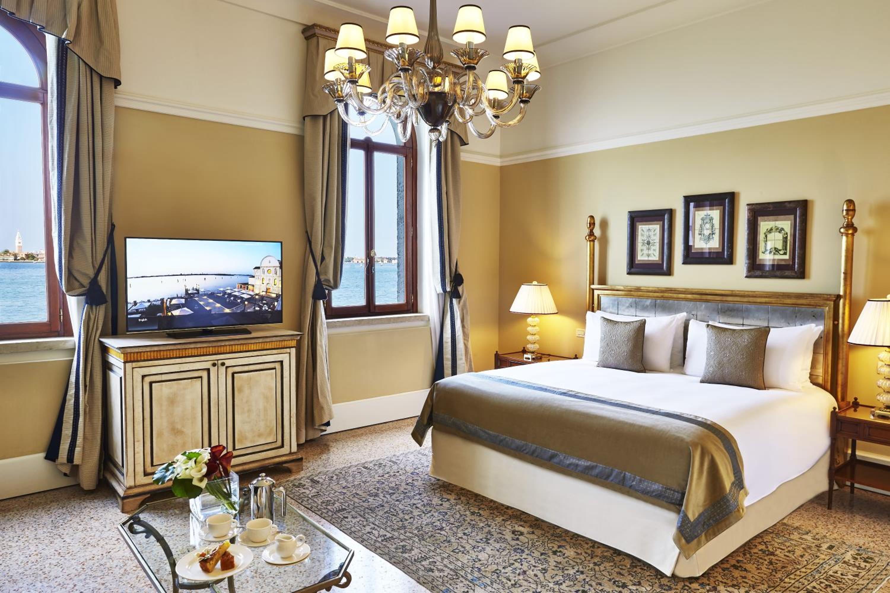 hotel room with a large bed and a flat screen tv