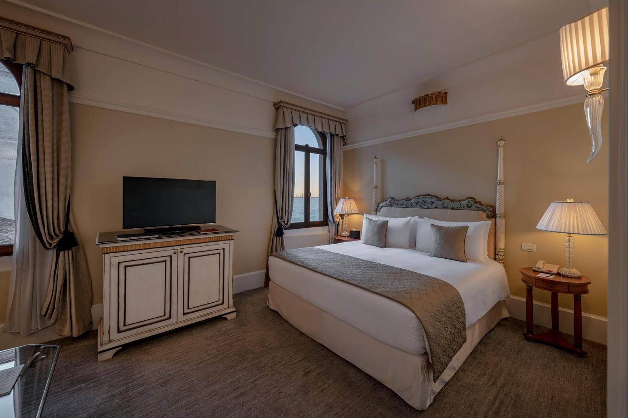 bedroom with a large bed and a flat screen tv