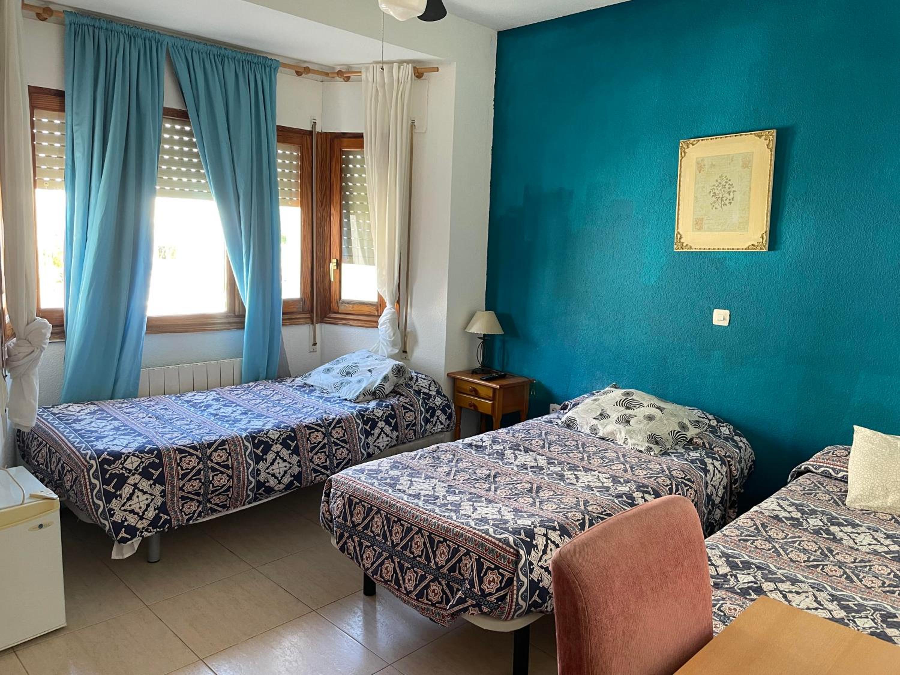 Habitación Triple Básica con Baño Compartido