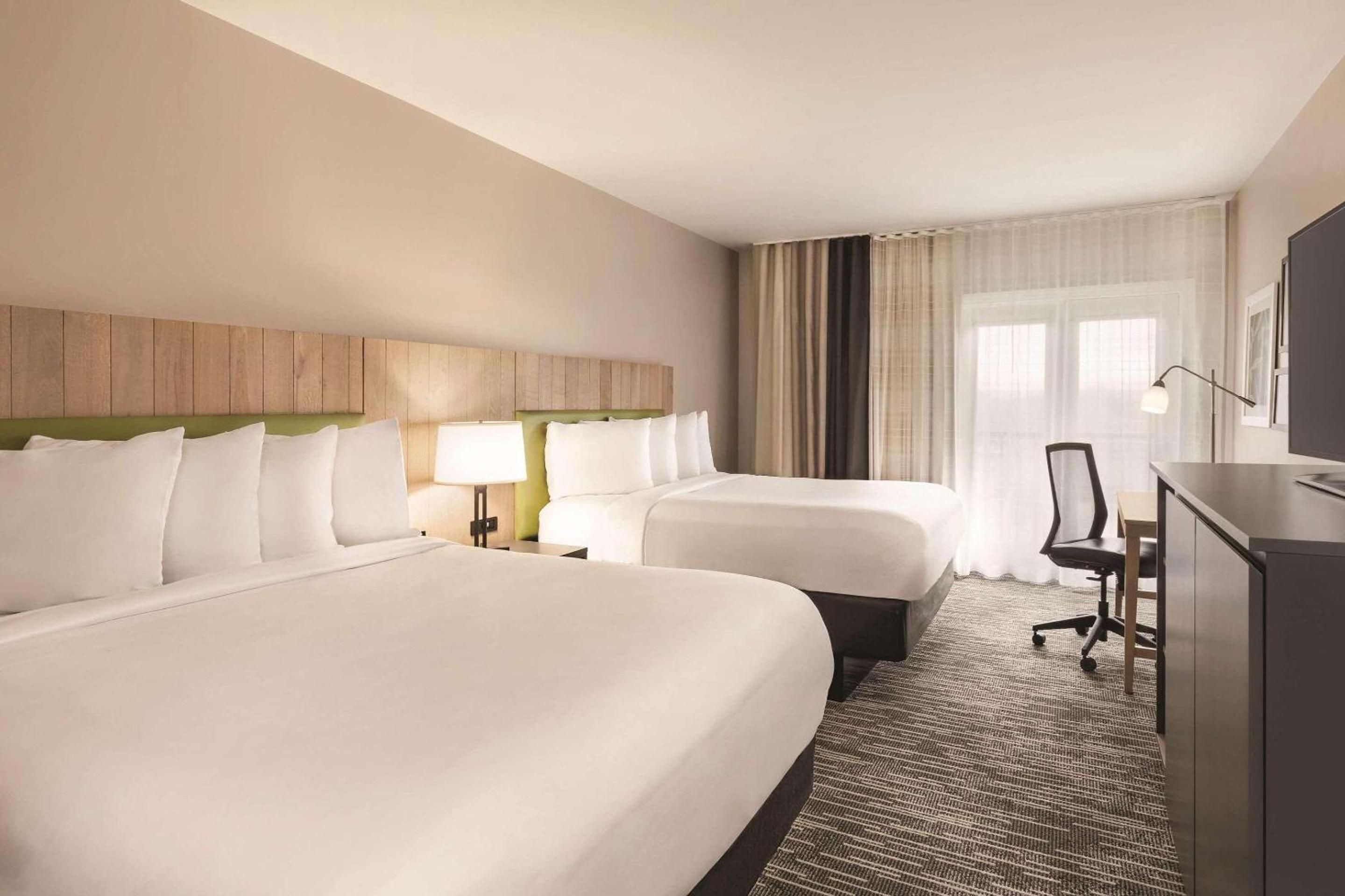 Premium Queen Room with Two Queen Beds and Balcony - Disability Access/Non-Smoking - Photo 1