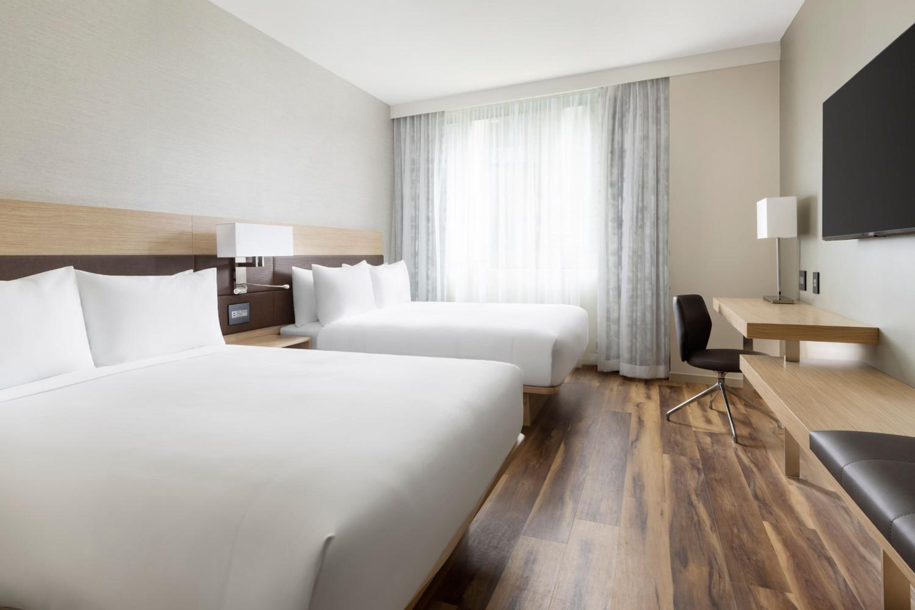 Queen Room with Two Queen Beds and City View - Photo 1