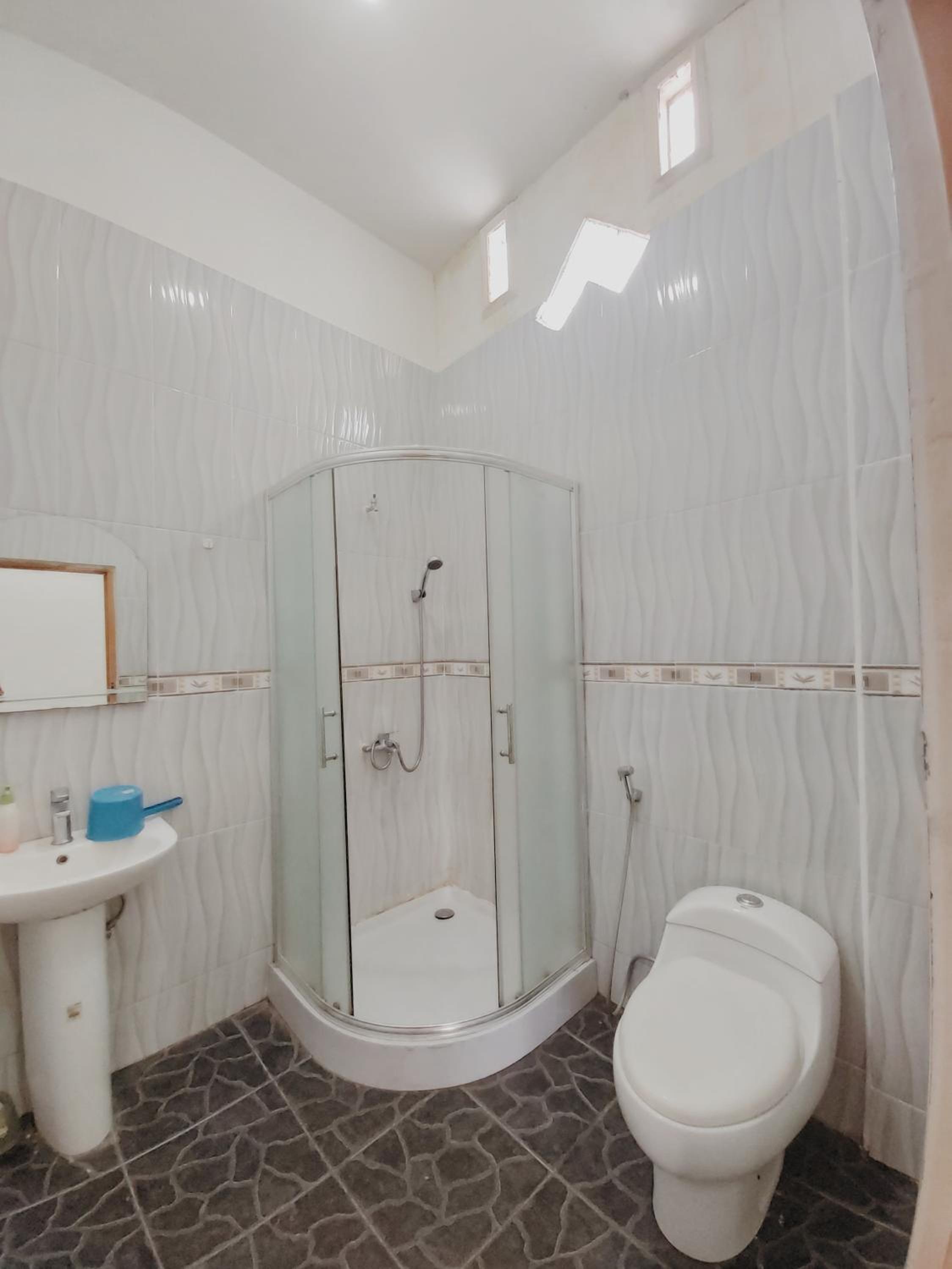 Three-Bedroom House - Photo 16