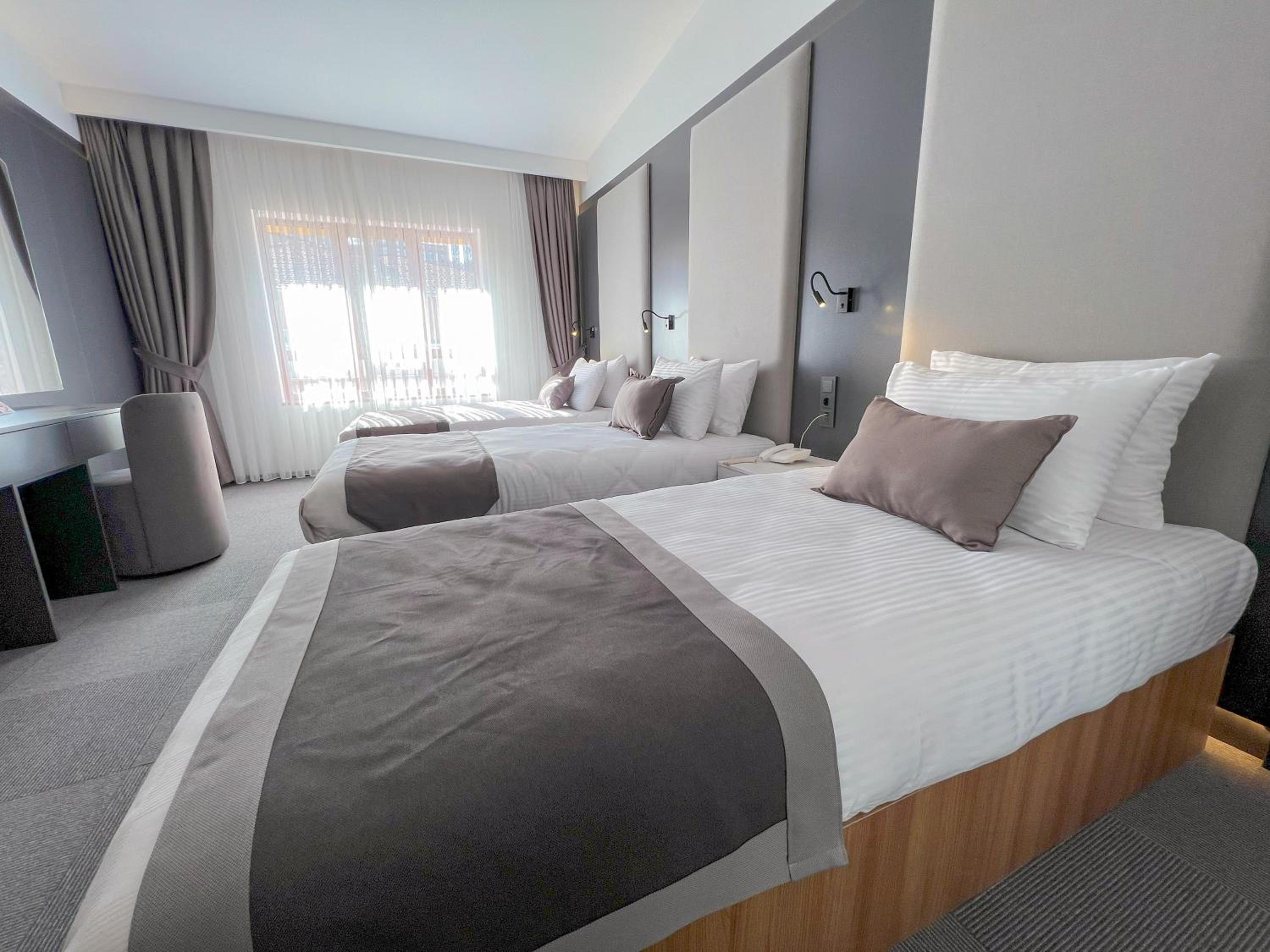 Premium Quadruple Room - Photo 10