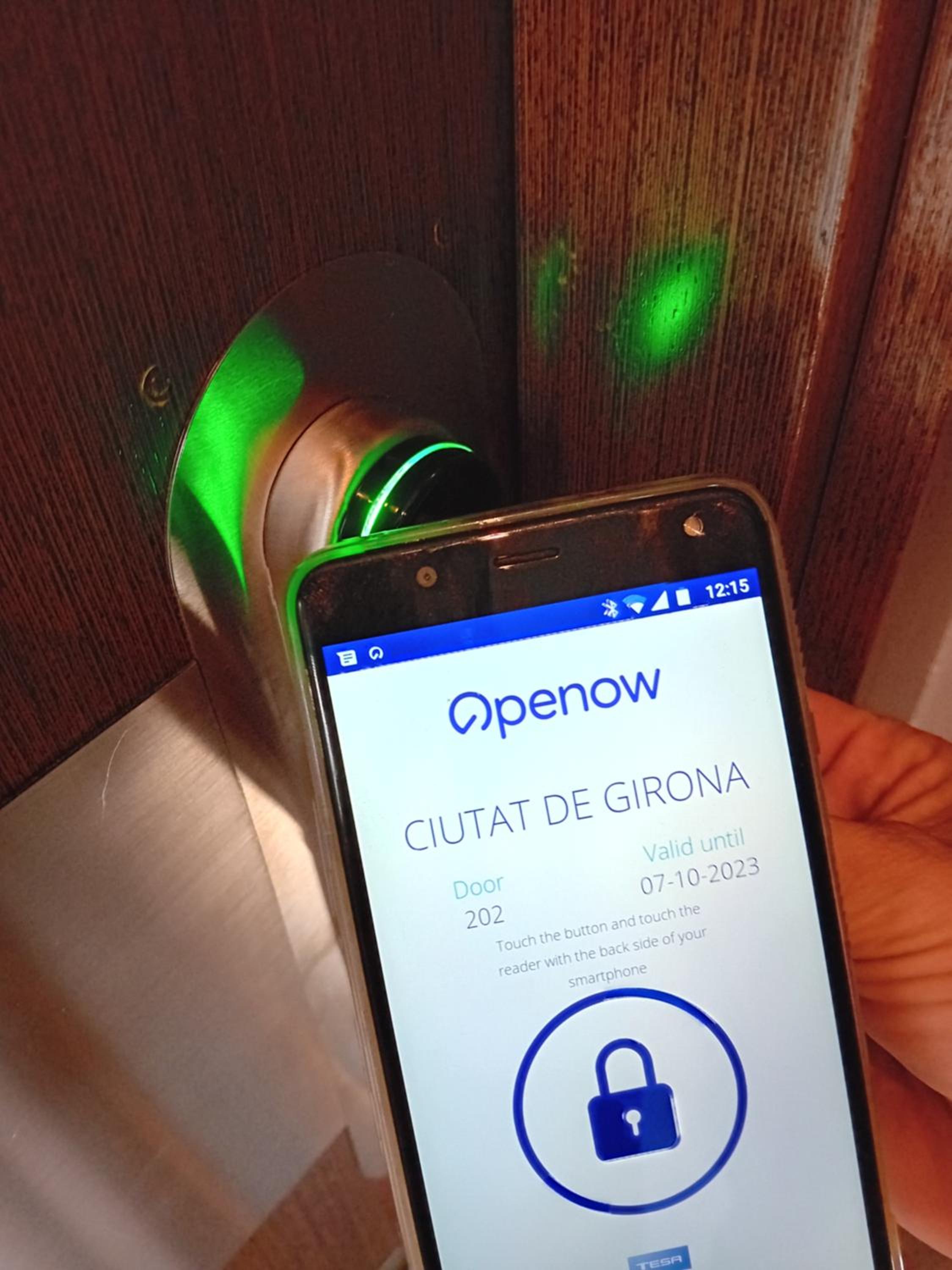 hand holding a smart phone with a lock on it