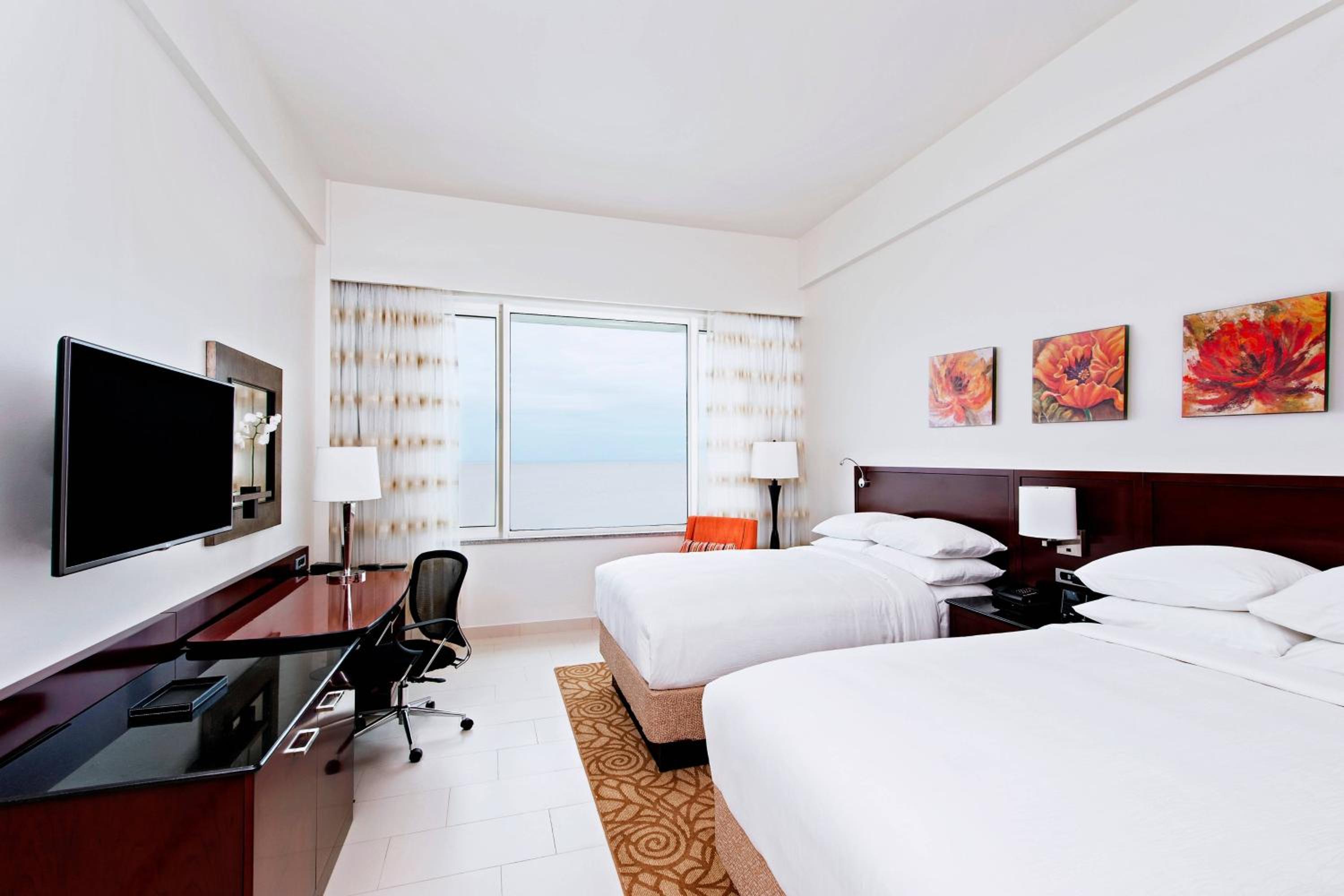 Deluxe Guest Room with Two Double Beds and Ocean View