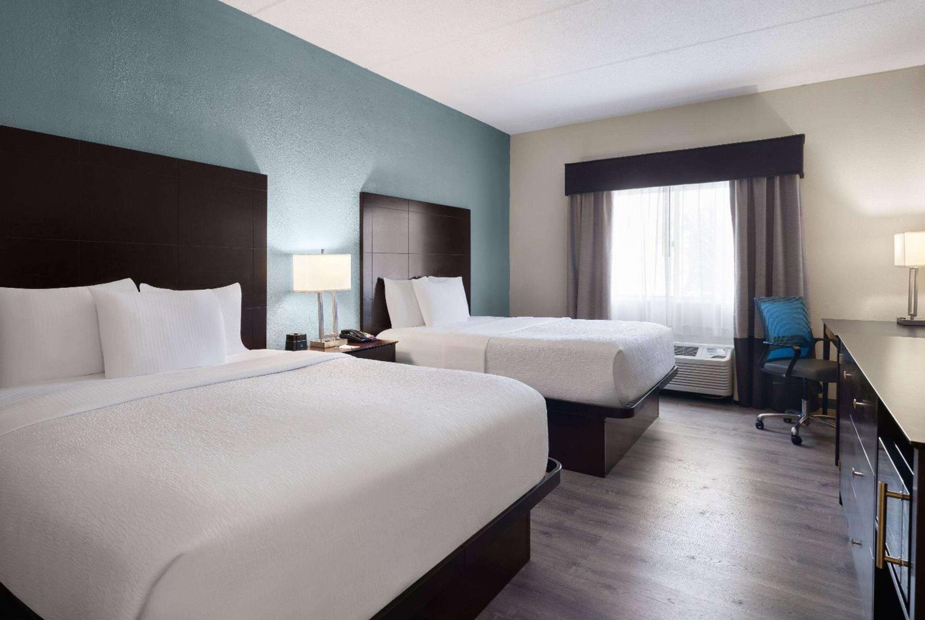 Queen Room with Two Queen Beds and Bath Tub - Mobility Accessible/Pet-Friendly - Non-Smoking - Photo 1