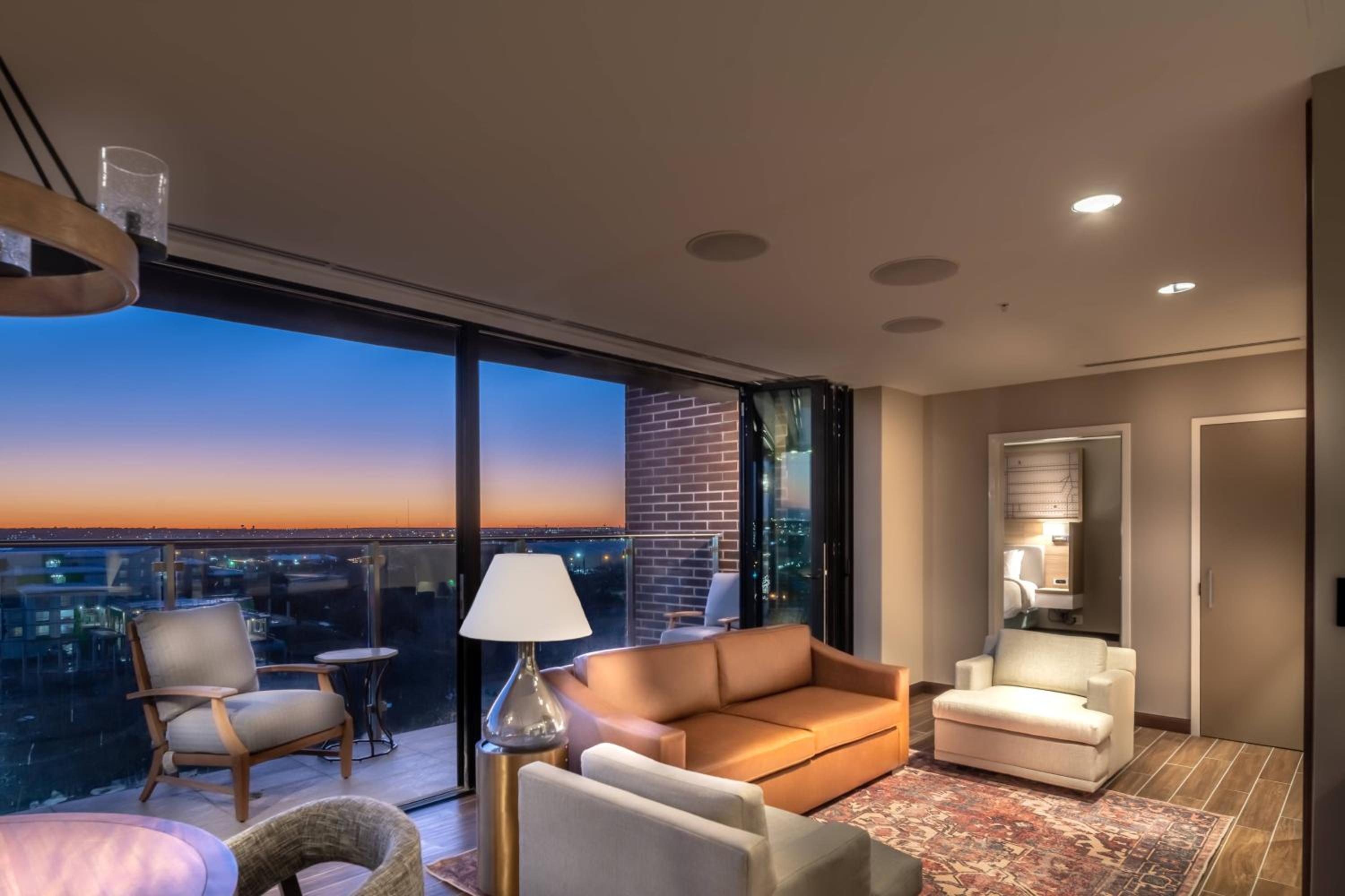 One-Bedroom King Suite with Balcony, Roll-In Shower and Sofa Bed - Mobility Access