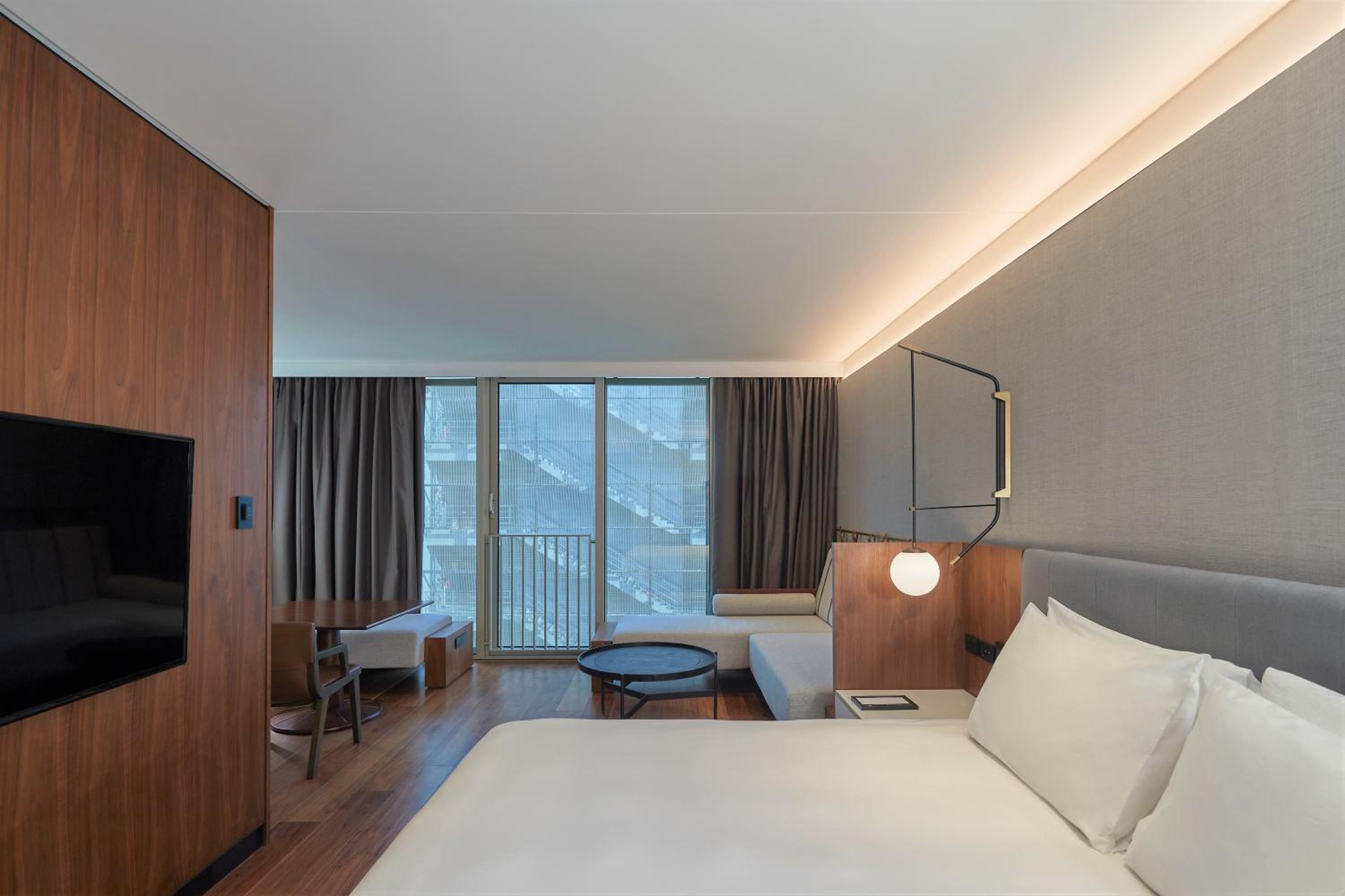 hotel room with a large bed and a flat screen tv