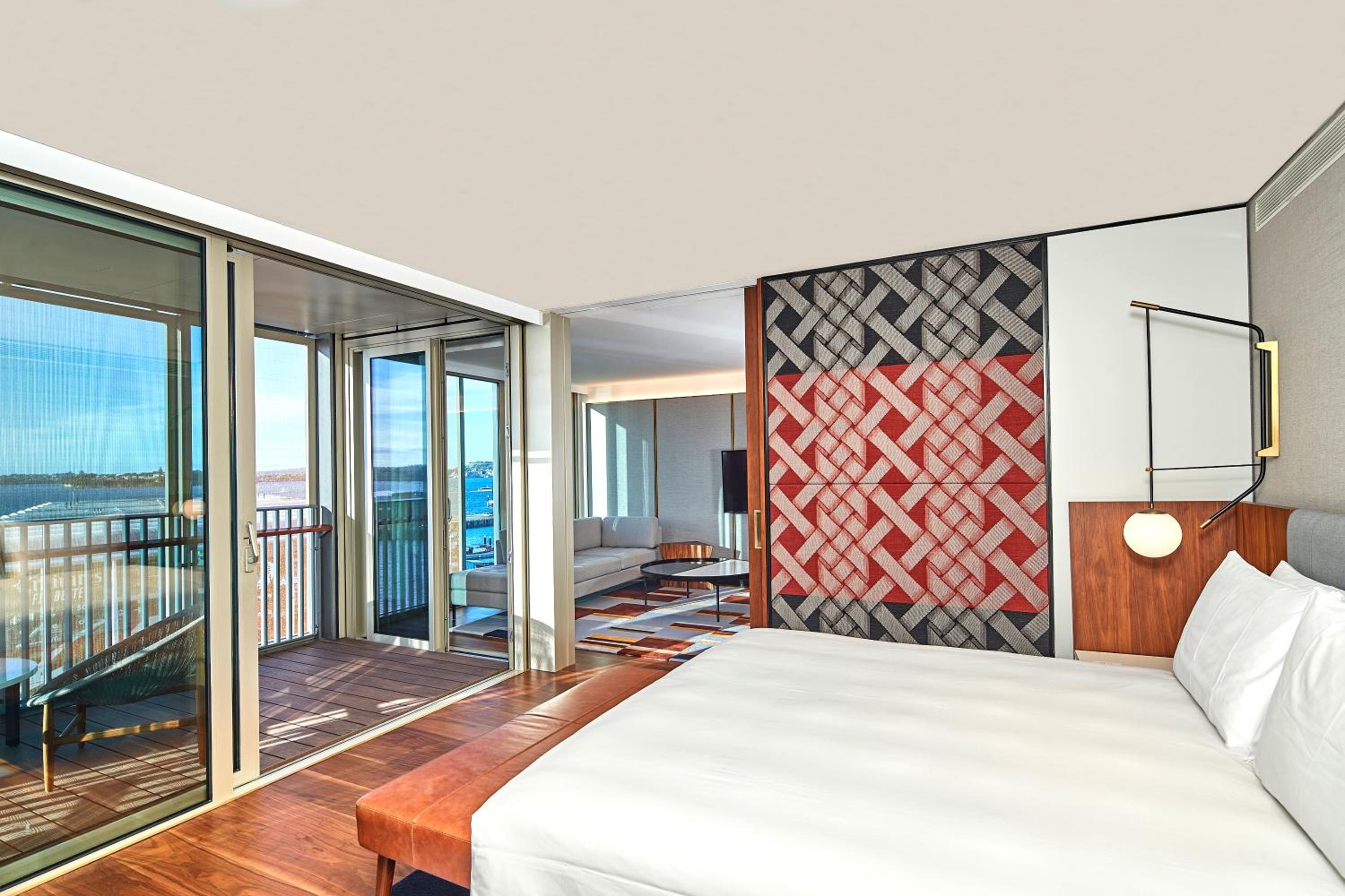 hotel room with a view of the ocean and a balcony