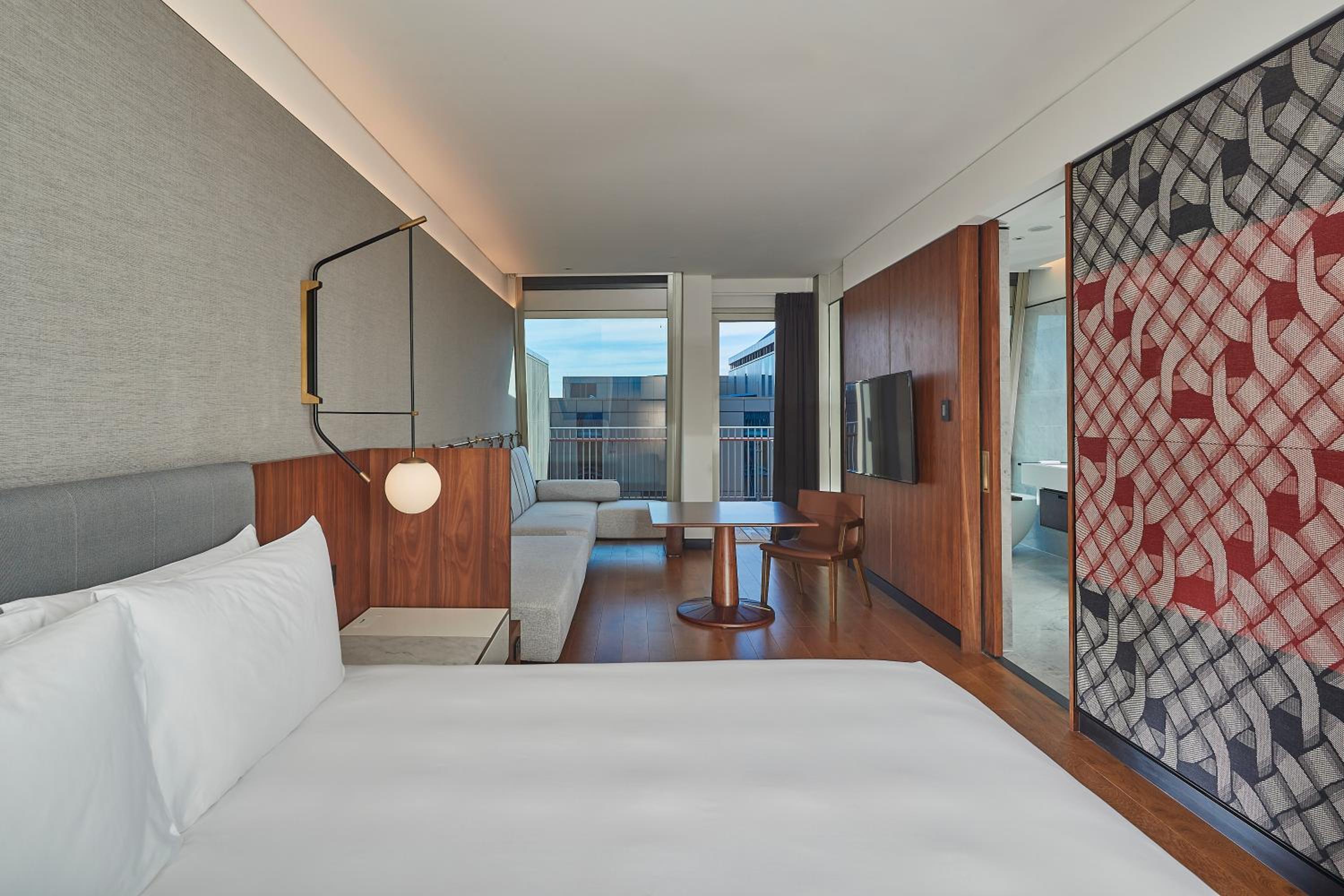 hotel room with a large bed and a view of the city