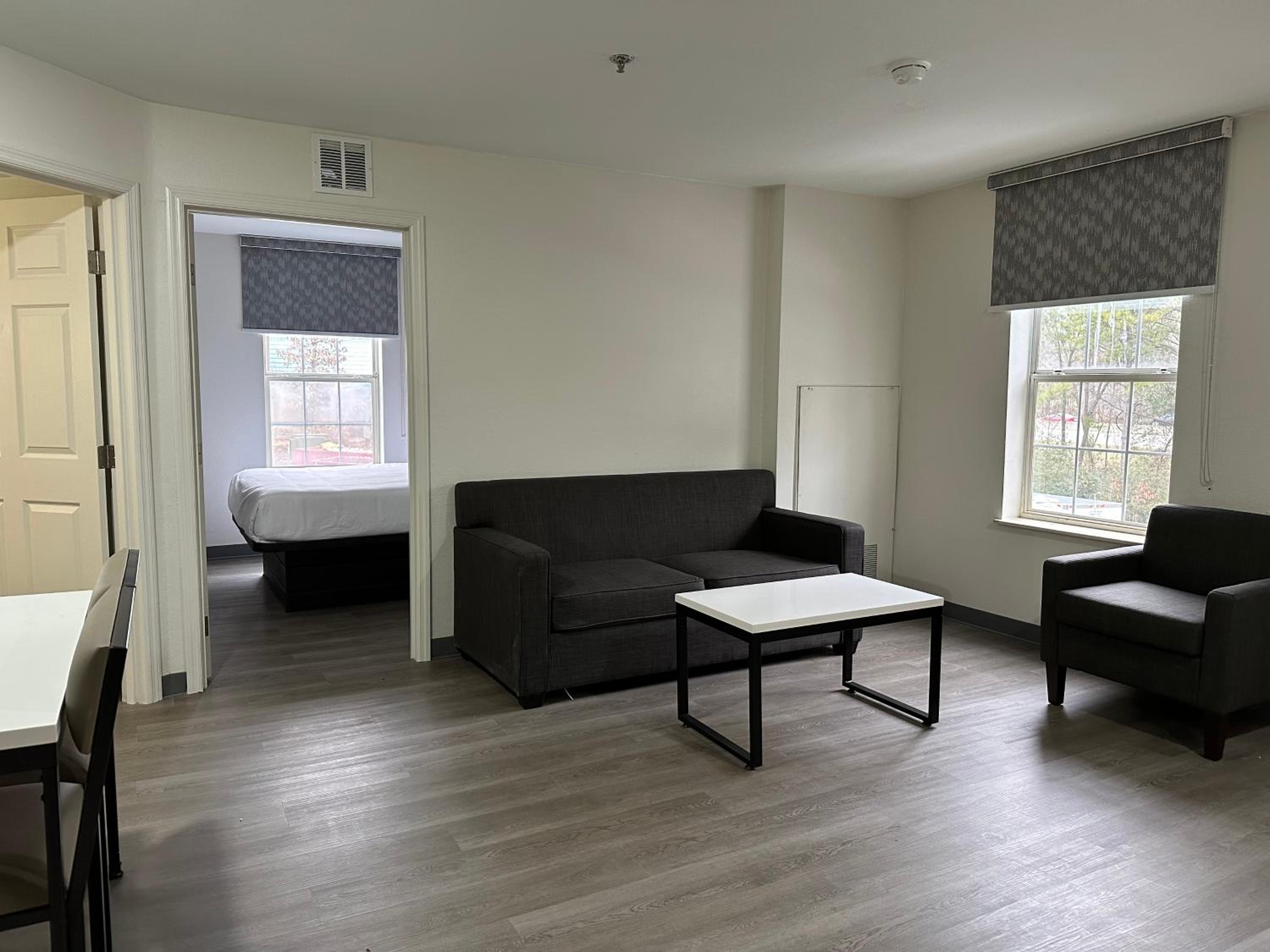 Efficiency Queen Suite with Three Queen Beds and Sofa bed - Non Smoking - Photo 1