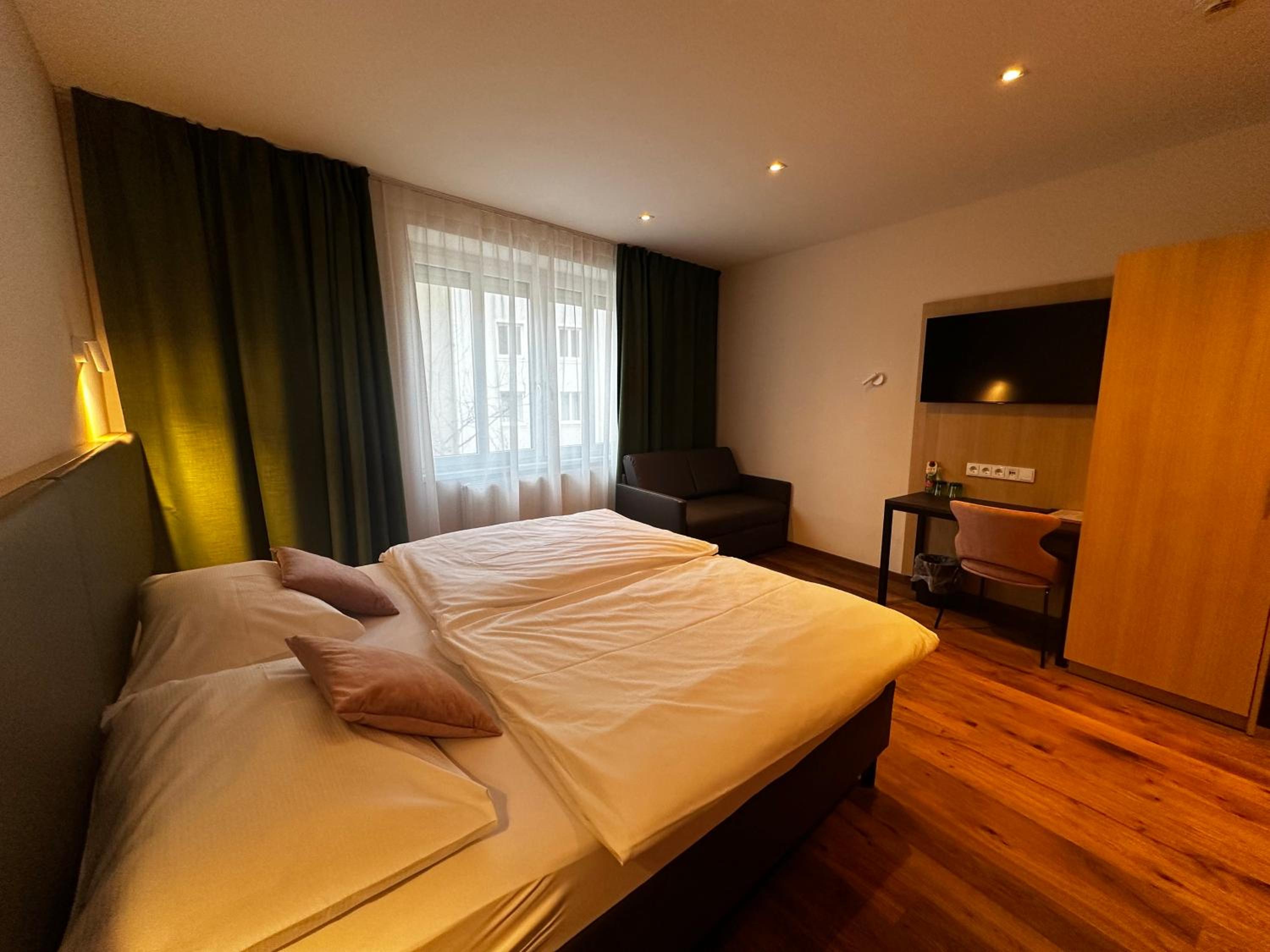 Double Room with Sofa Bed (3 Adults + 1 Child)