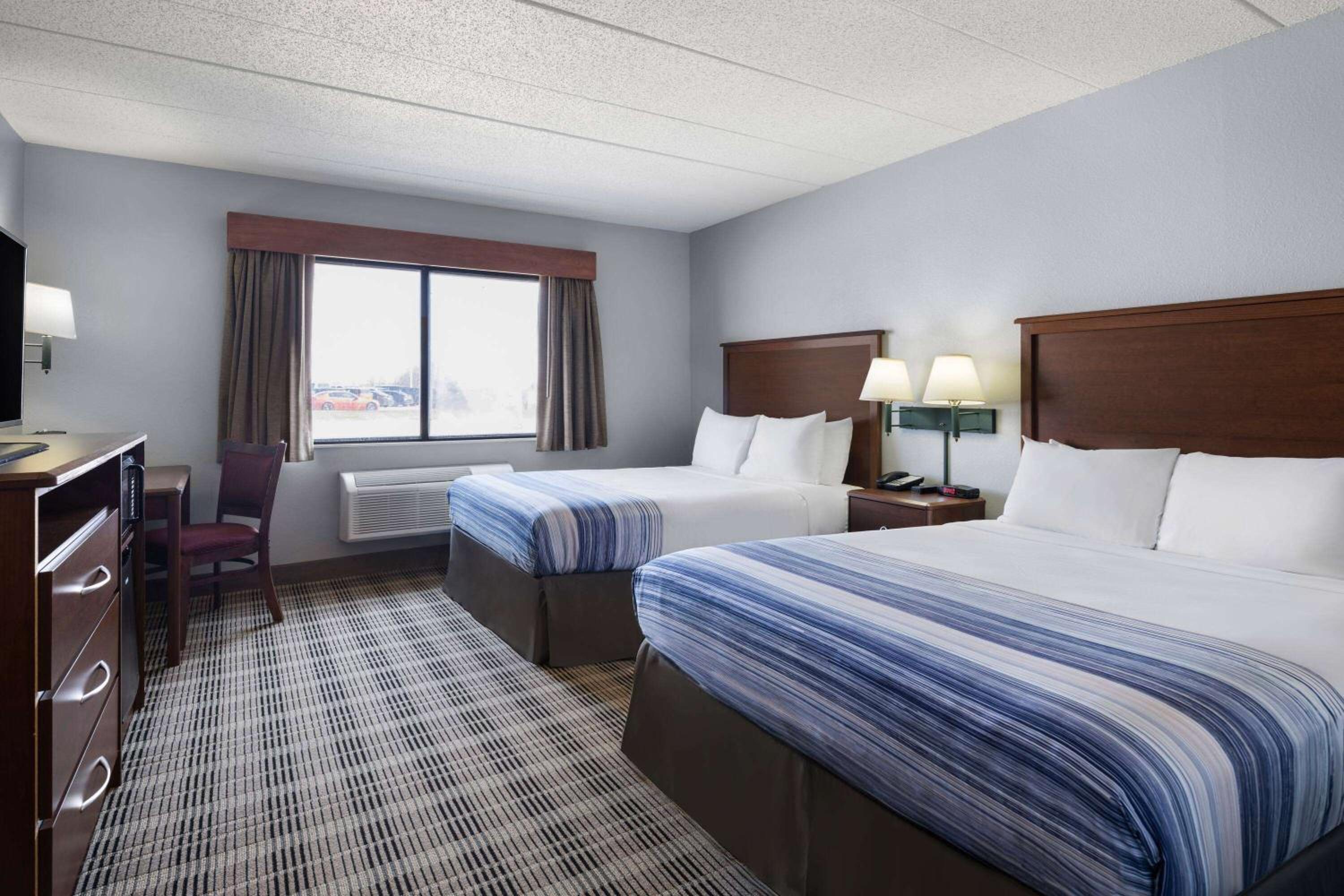 Deluxe Queen Room with Two Queen Beds - Non-Smoking photo 1
