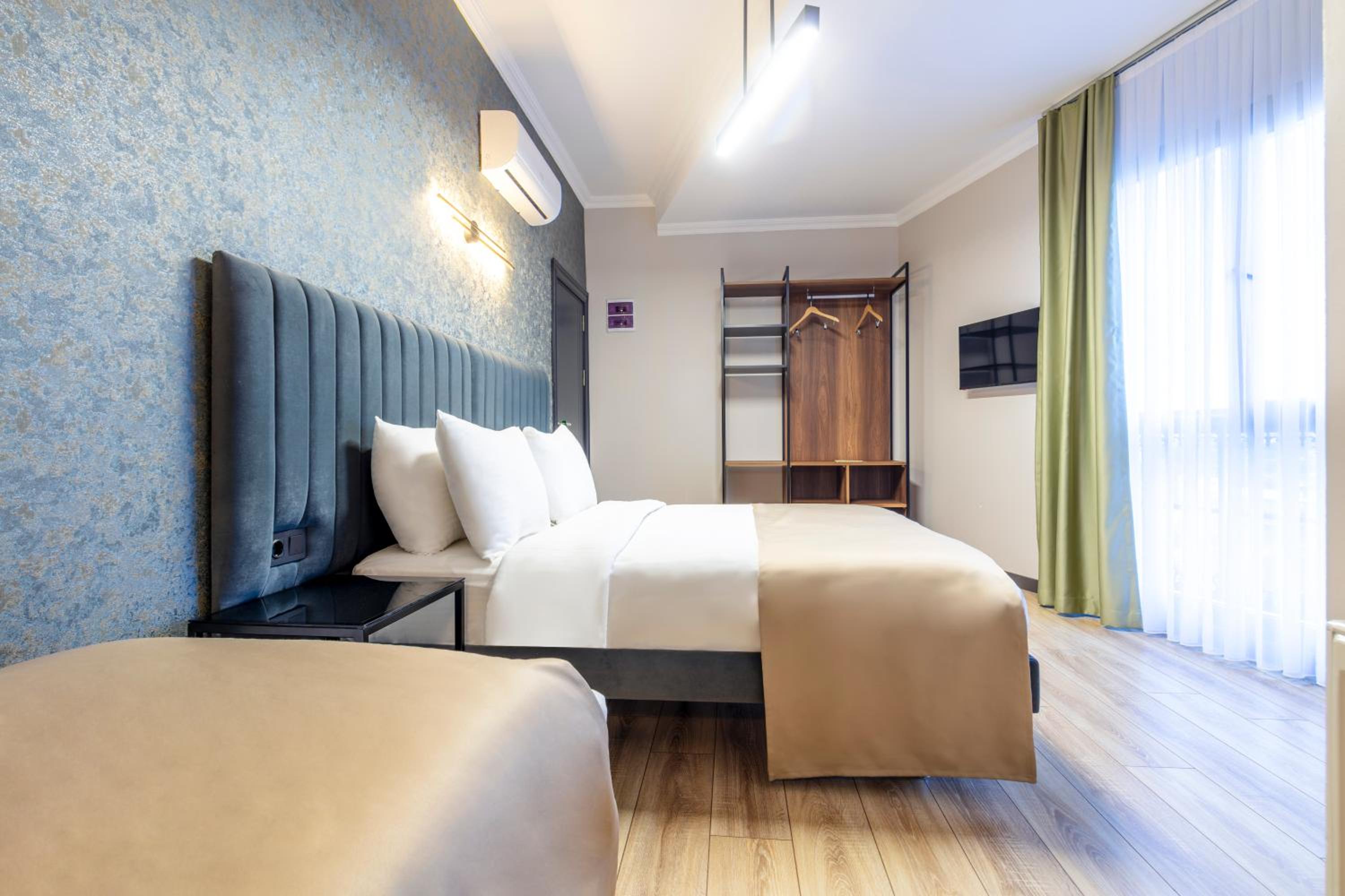 Deluxe Quadruple Room - Photo 7
