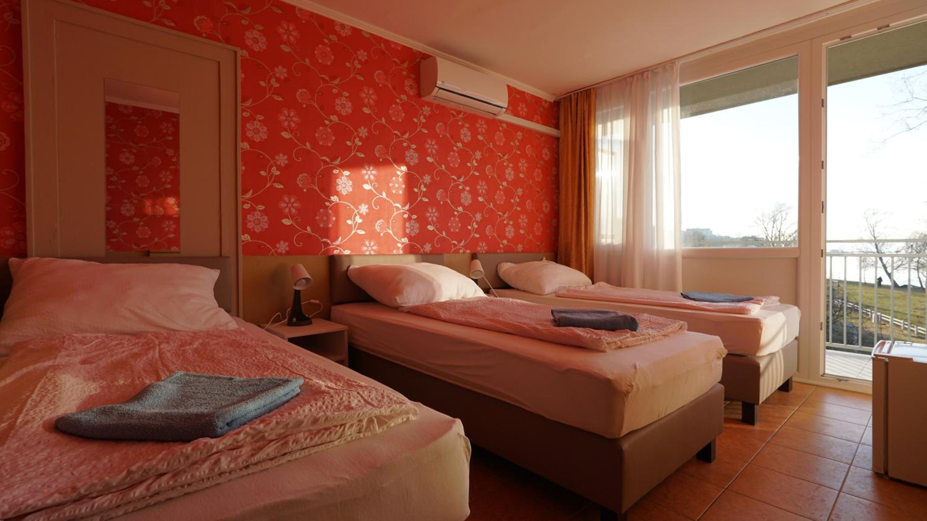 Triple Room with Balcony and Air Condition