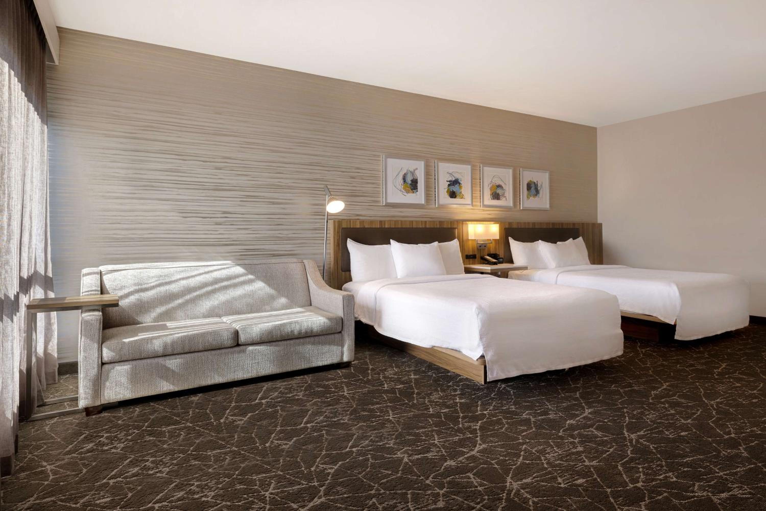 Deluxe Queen Room with Two Queen Beds and Sofa Bed - Photo 2
