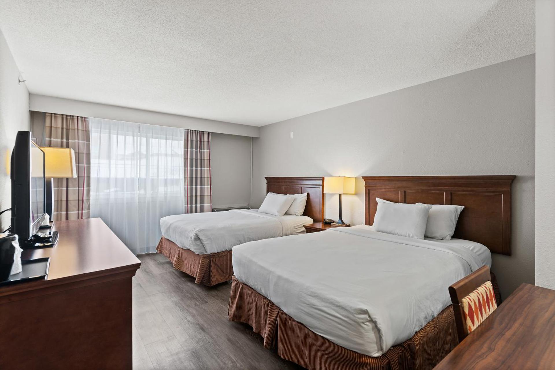 Queen Room with Two Queen Beds - Non-Smoking - Photo 1