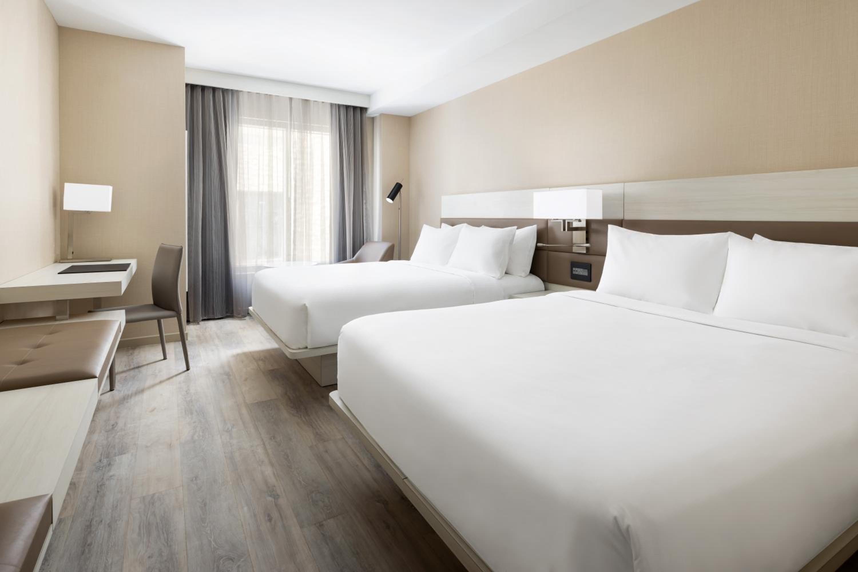 Queen Room with Two Queen Beds and City View photo 1