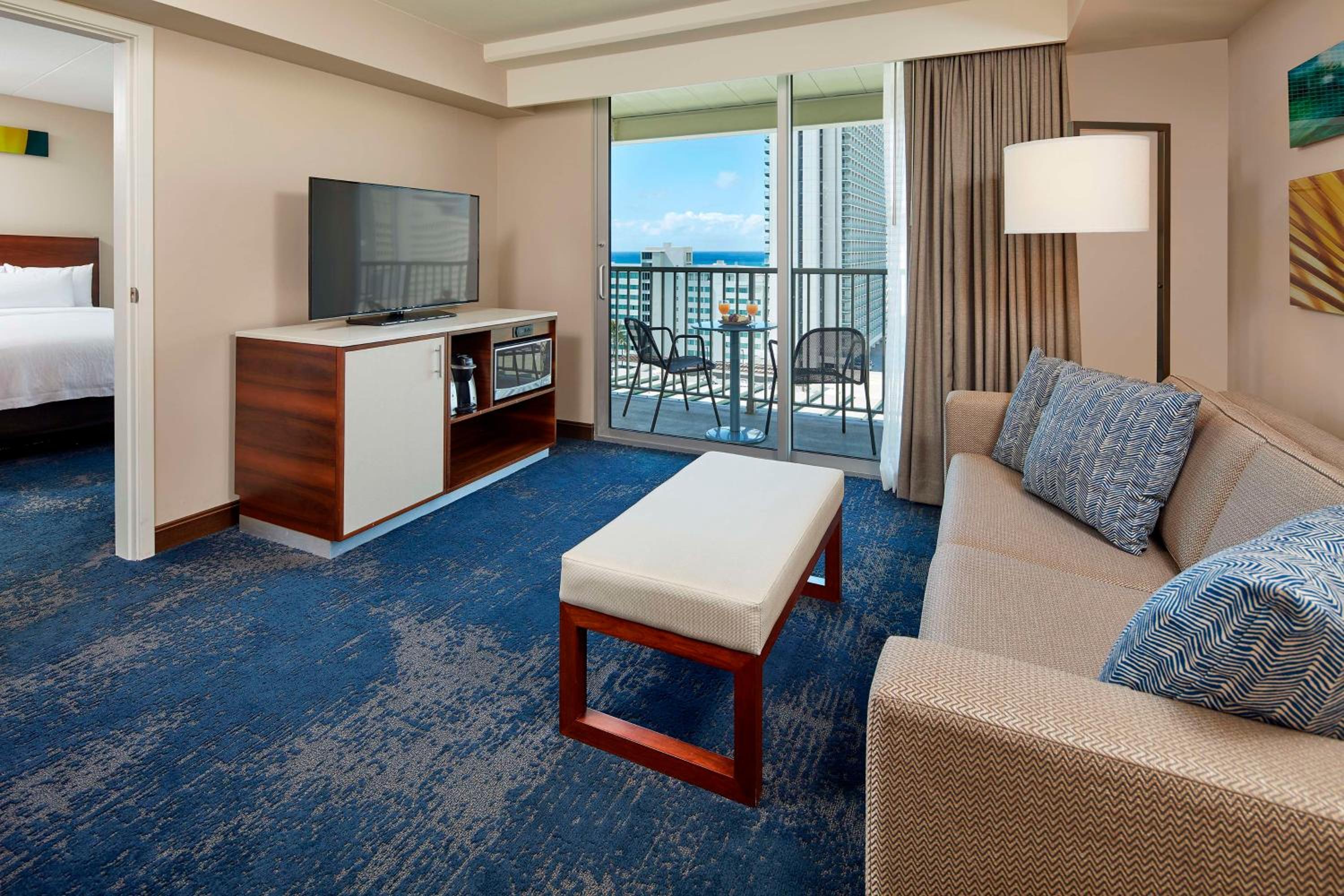 Suite with Two Double Beds and One Sofa Bed with Partial Ocean View