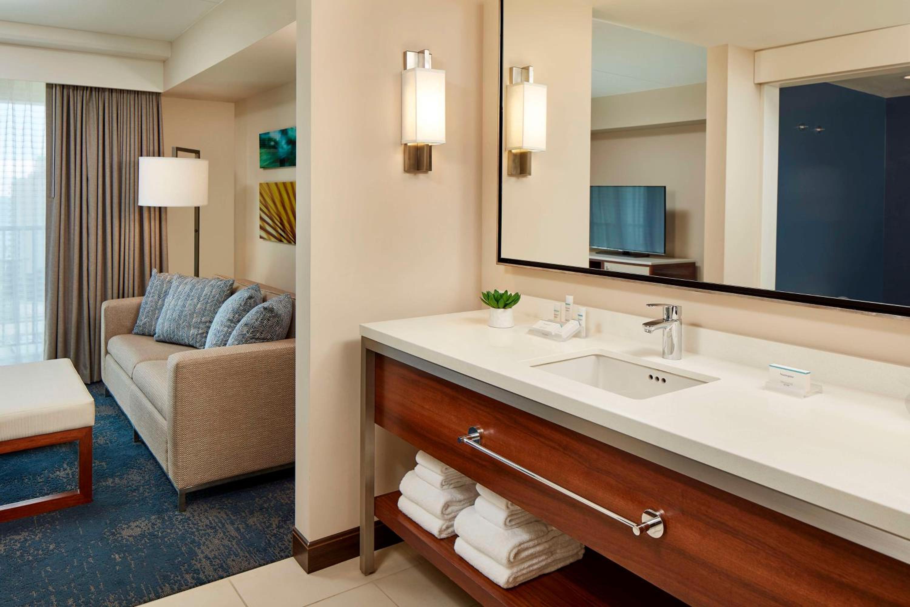 Suite with Two Double Beds and One Sofa Bed with Partial Ocean View