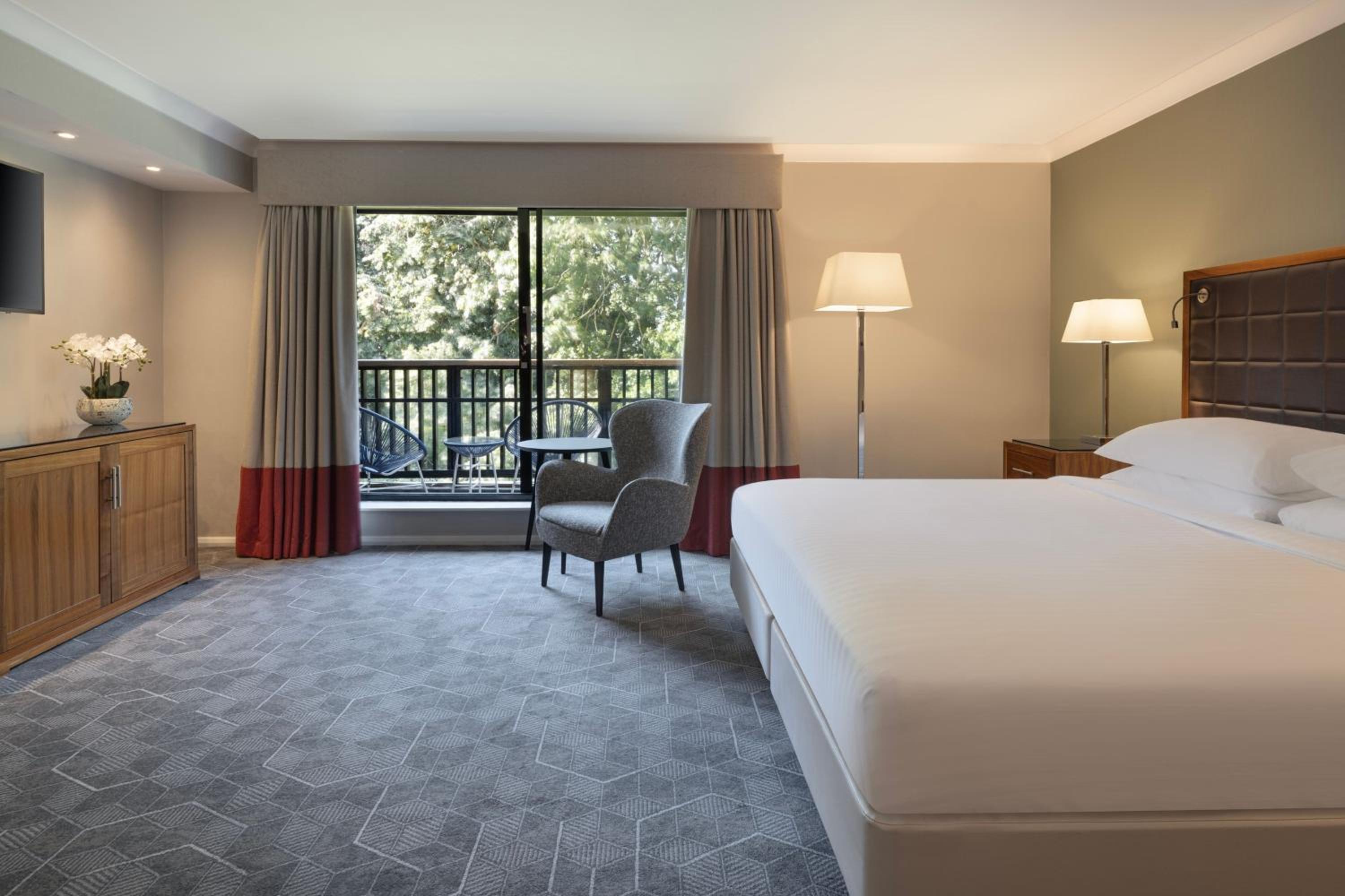 King Suite with Balcony - Photo 1