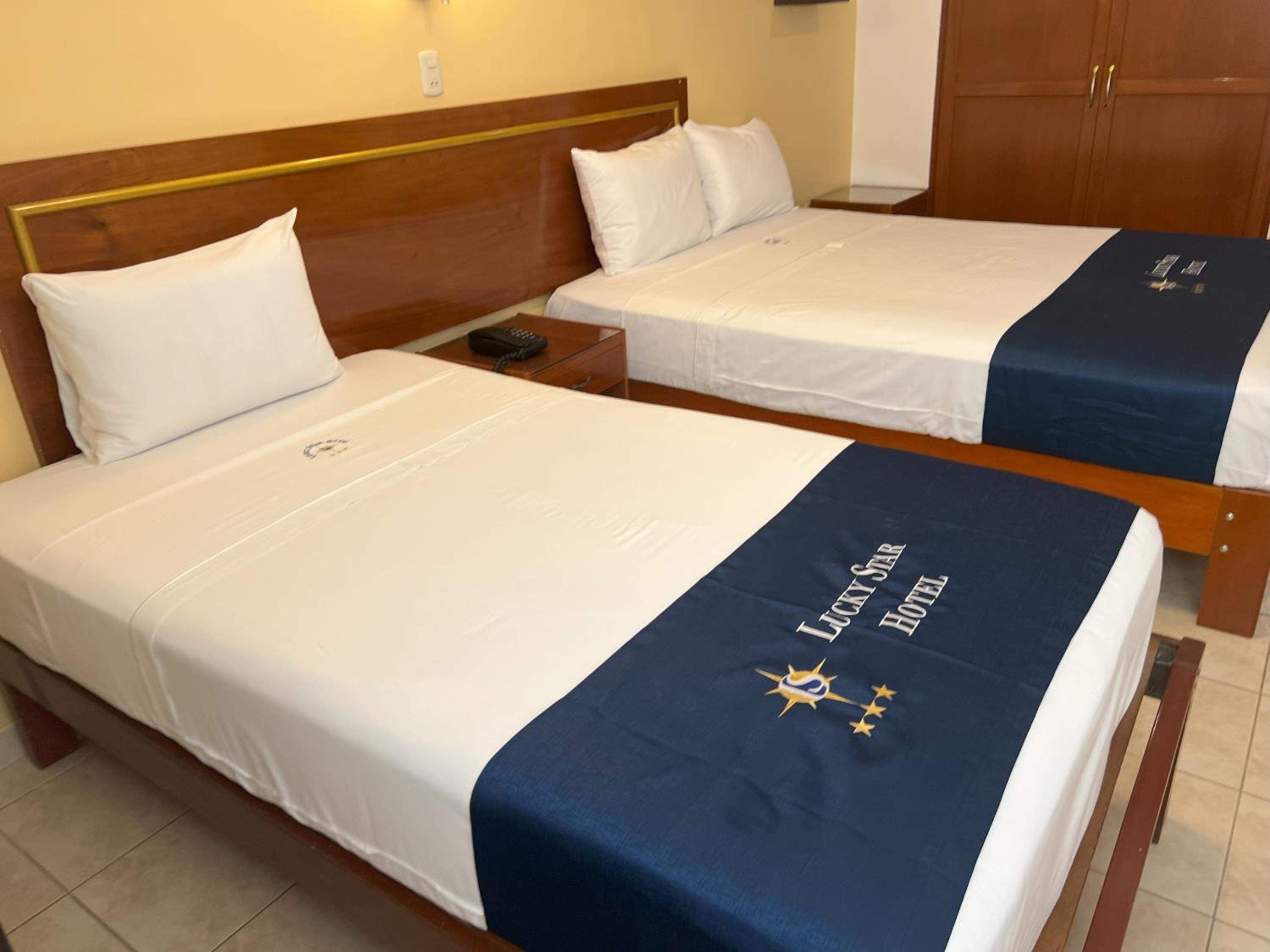 Standard Queen Room with Two Queen Beds photo 1