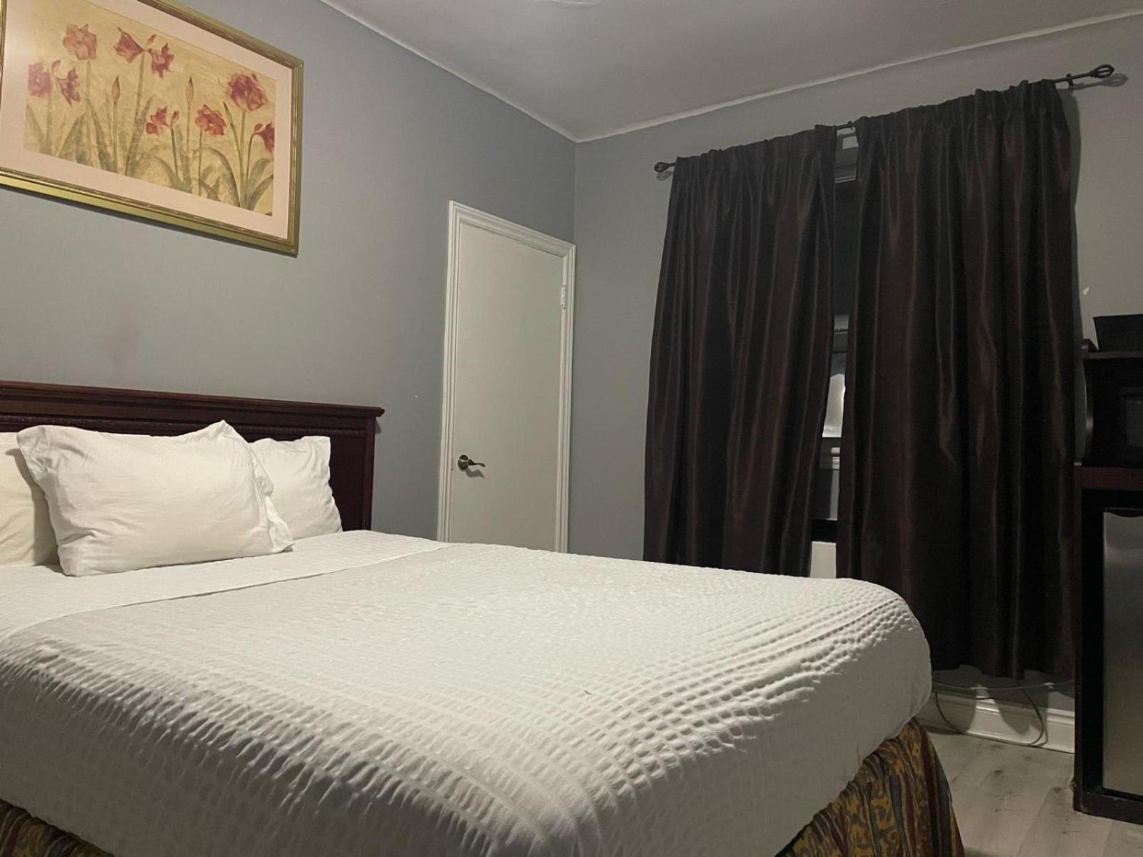 bedroom with a large bed and a flat screen tv