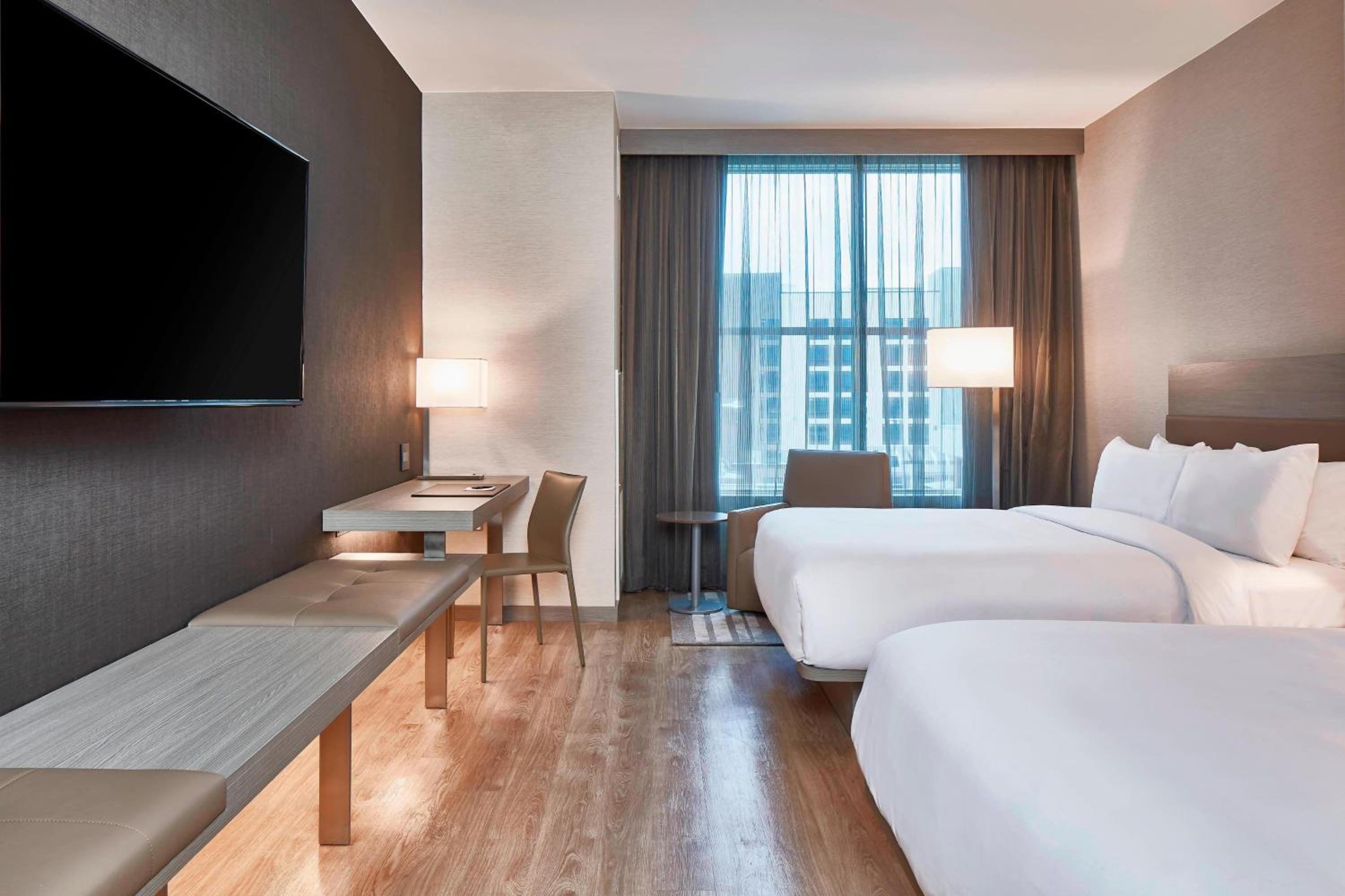 Queen Room with Two Queen Beds - Hearing Accessible photo 1