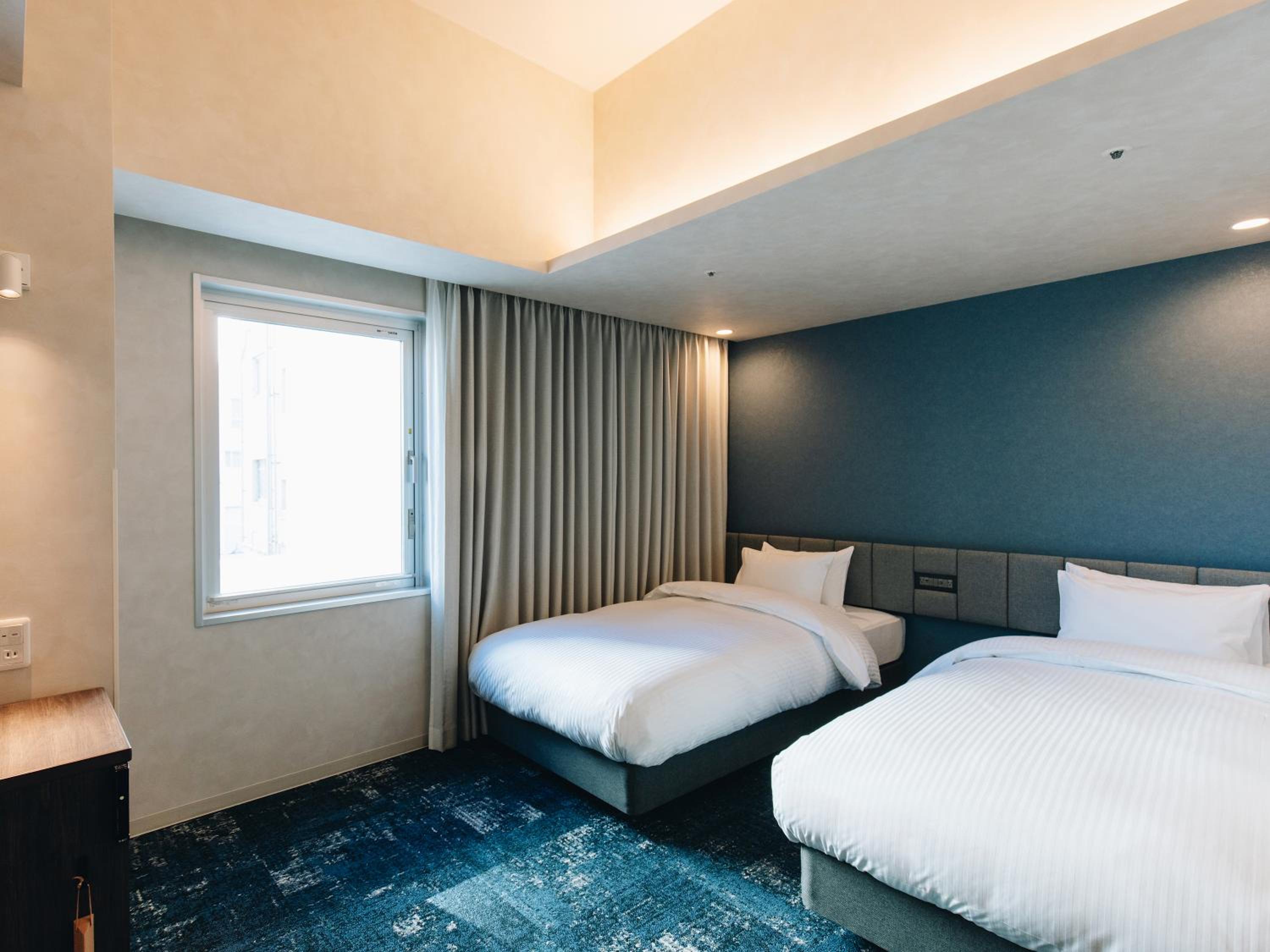Universal Twin Room - Photo 1