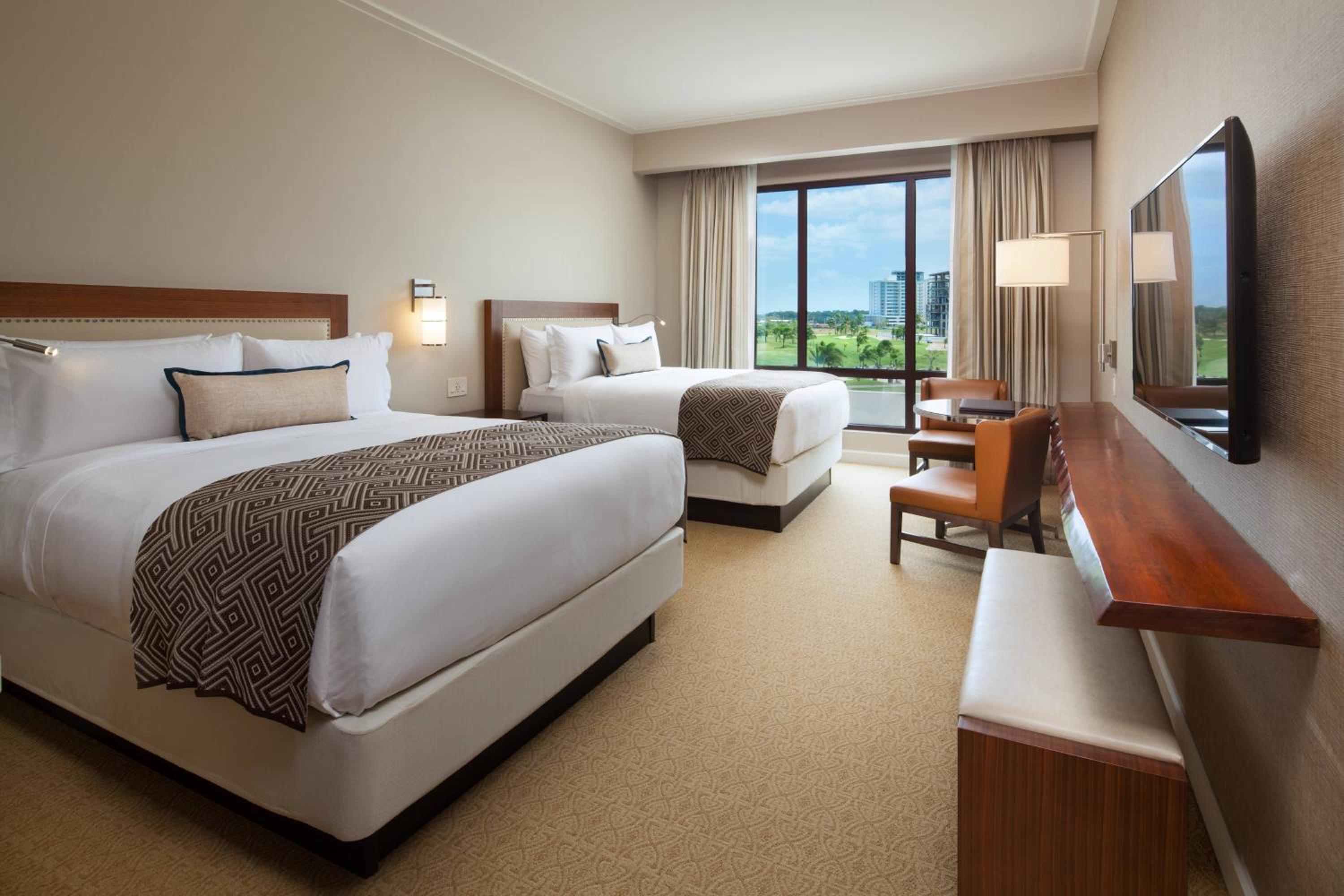 Deluxe Queen Room with Two Queen Beds and Golf View photo 2