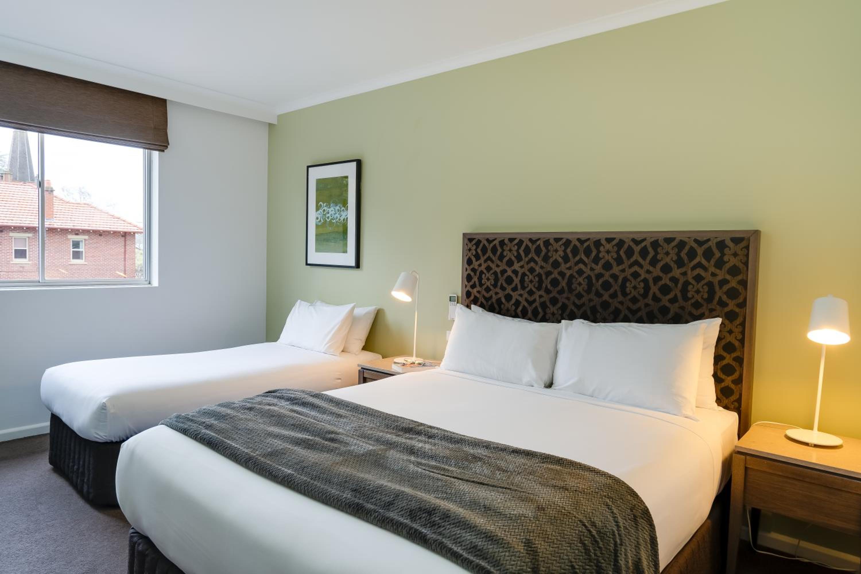 Superior Room with Queen and Twin Beds - Photo 8