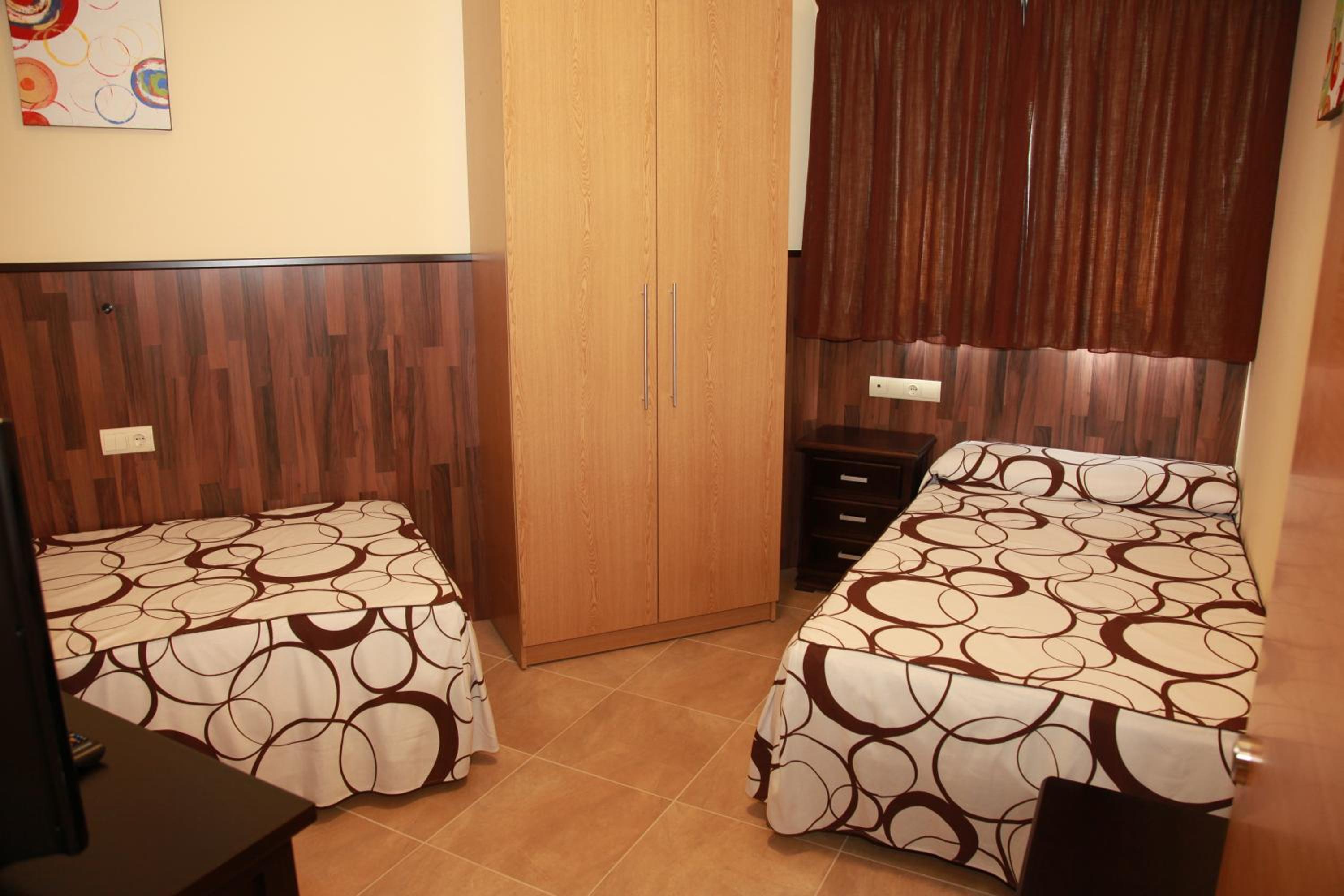 Habitación Deluxe Queen con Dos Camas Queen