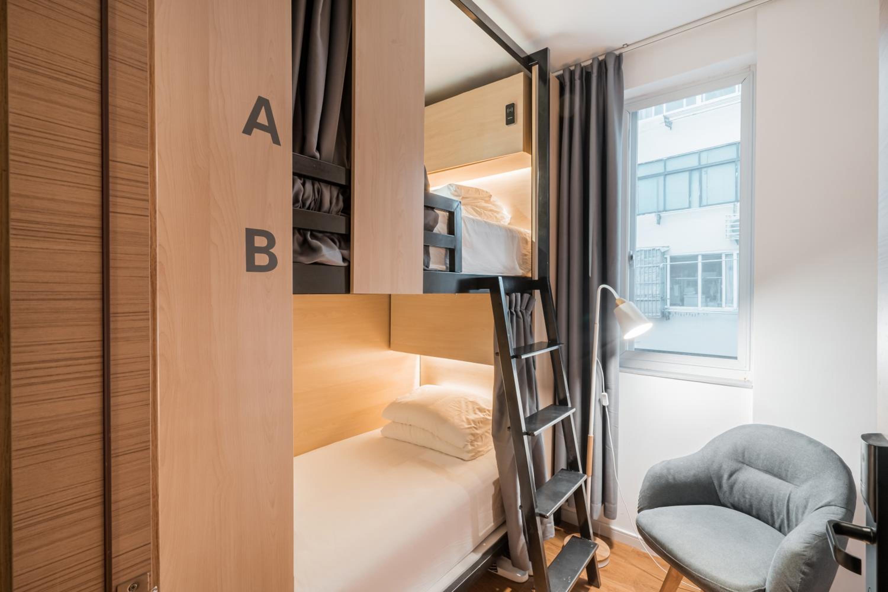 Bunk Bed In Male Dormitory Room With Shared Bathroom