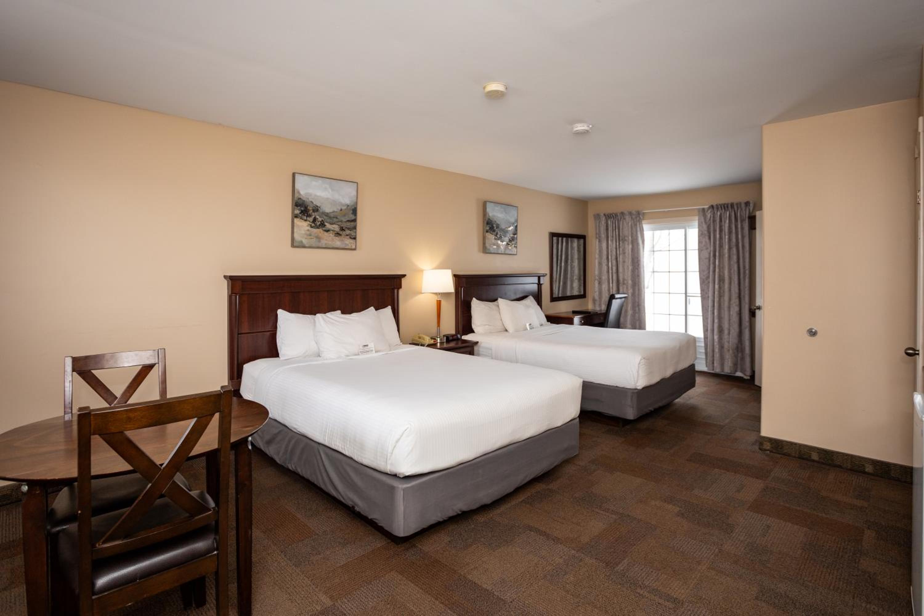 Queen Room with Two Queen Beds - Non-Smoking - Photo 1