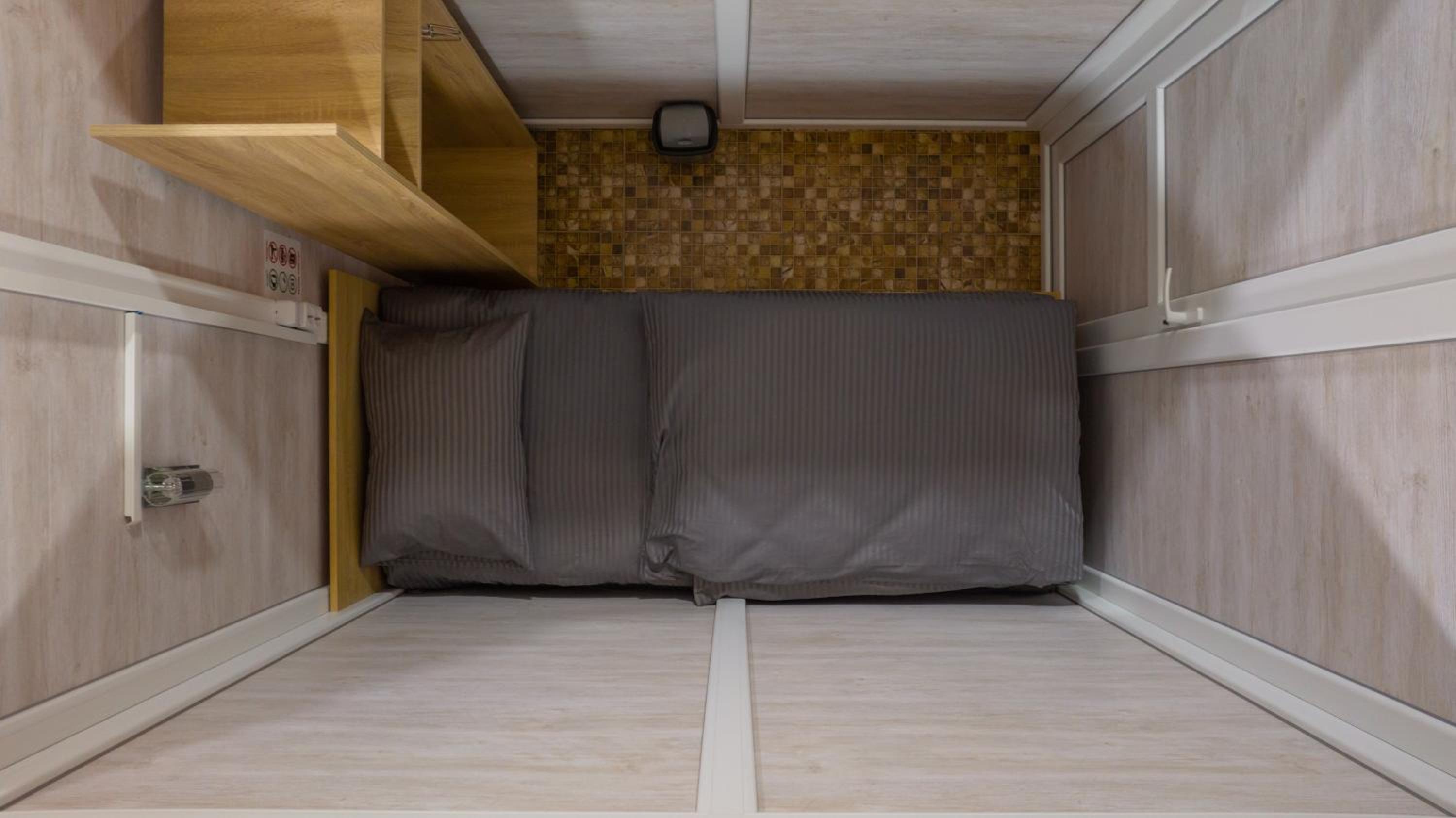 Single Bed in Dormitory Room