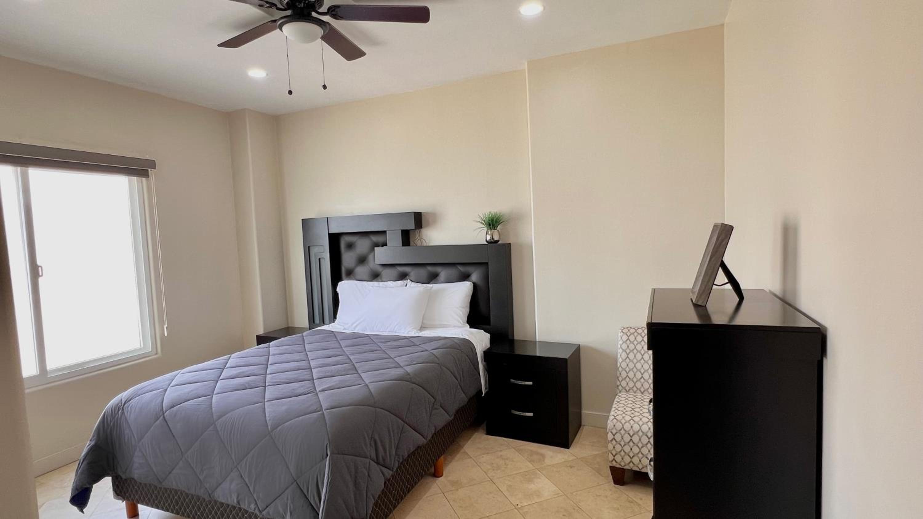 Three-Bedroom Apartment - Photo 30