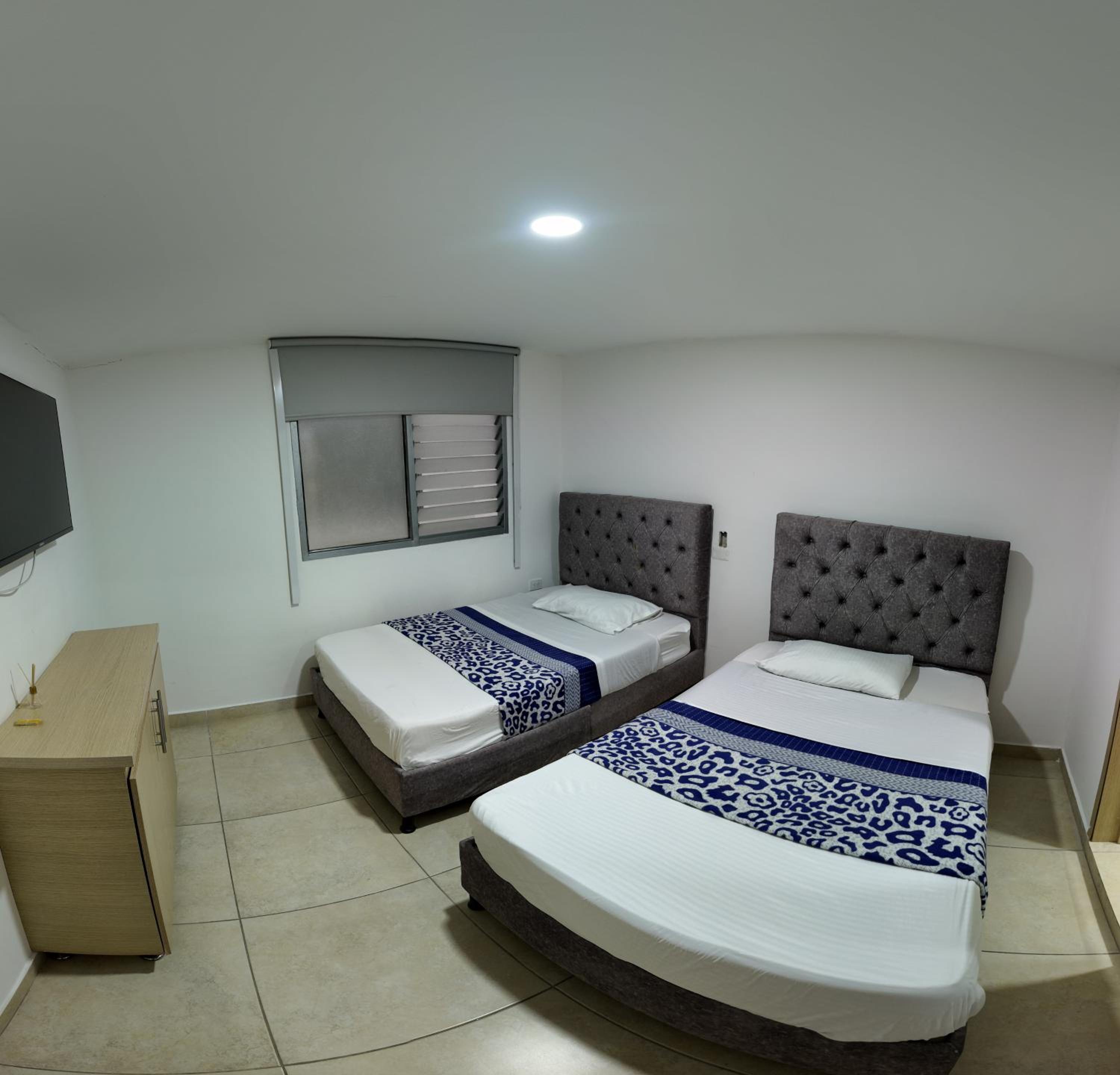 Deluxe Queen Room With Two Queen Beds photo 2