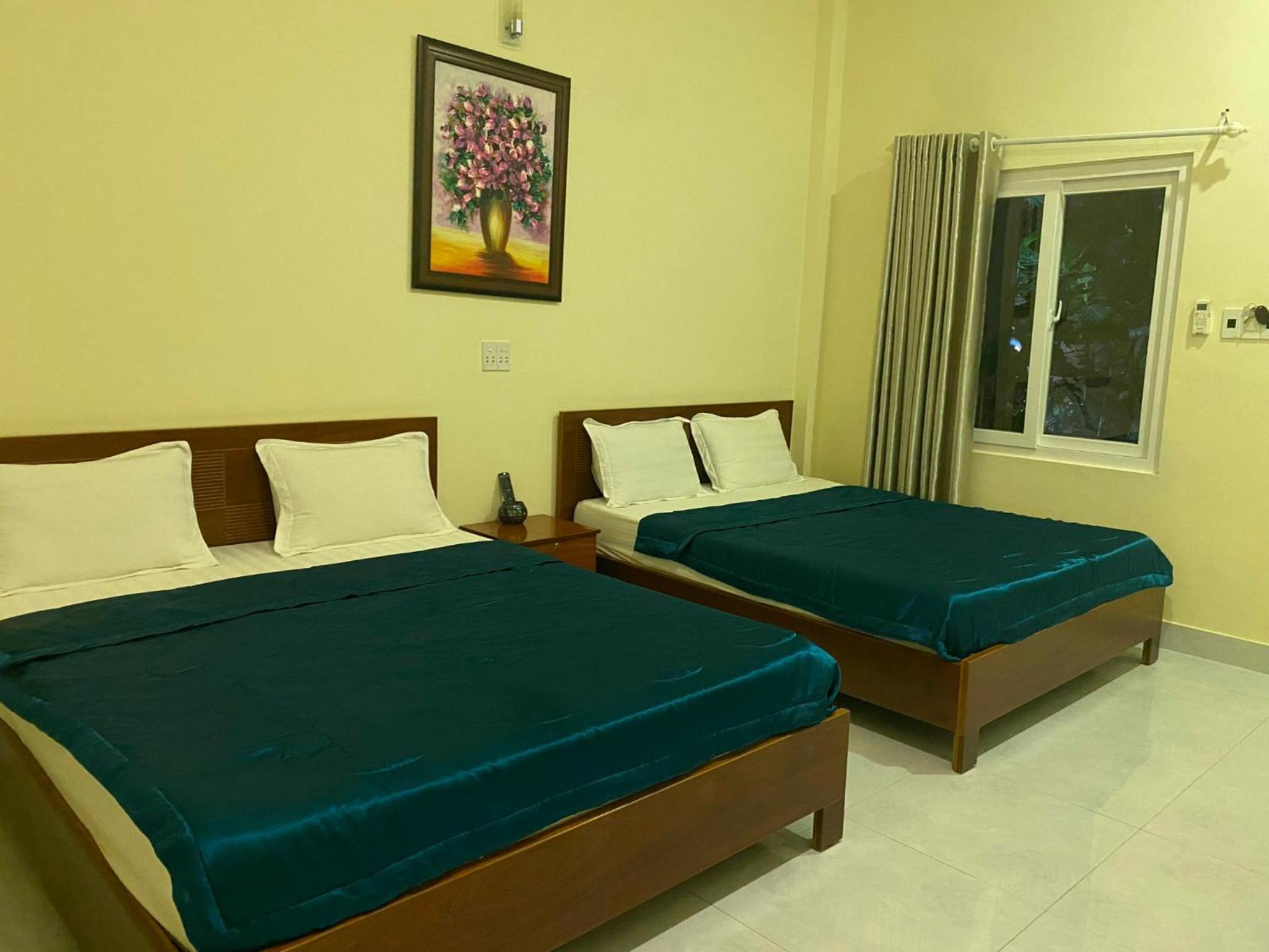 Deluxe Queen Room with Two Queen Beds photo 1